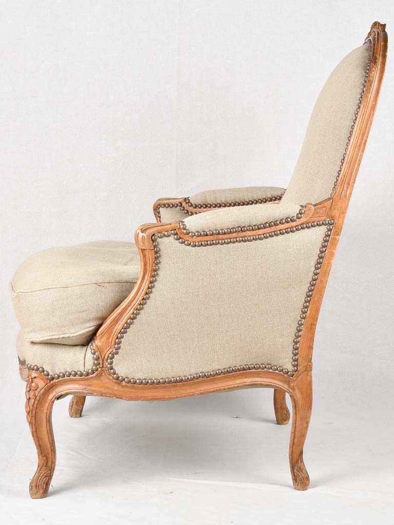 Large pair of 19th century Bergere armchairs with new linen uphostery