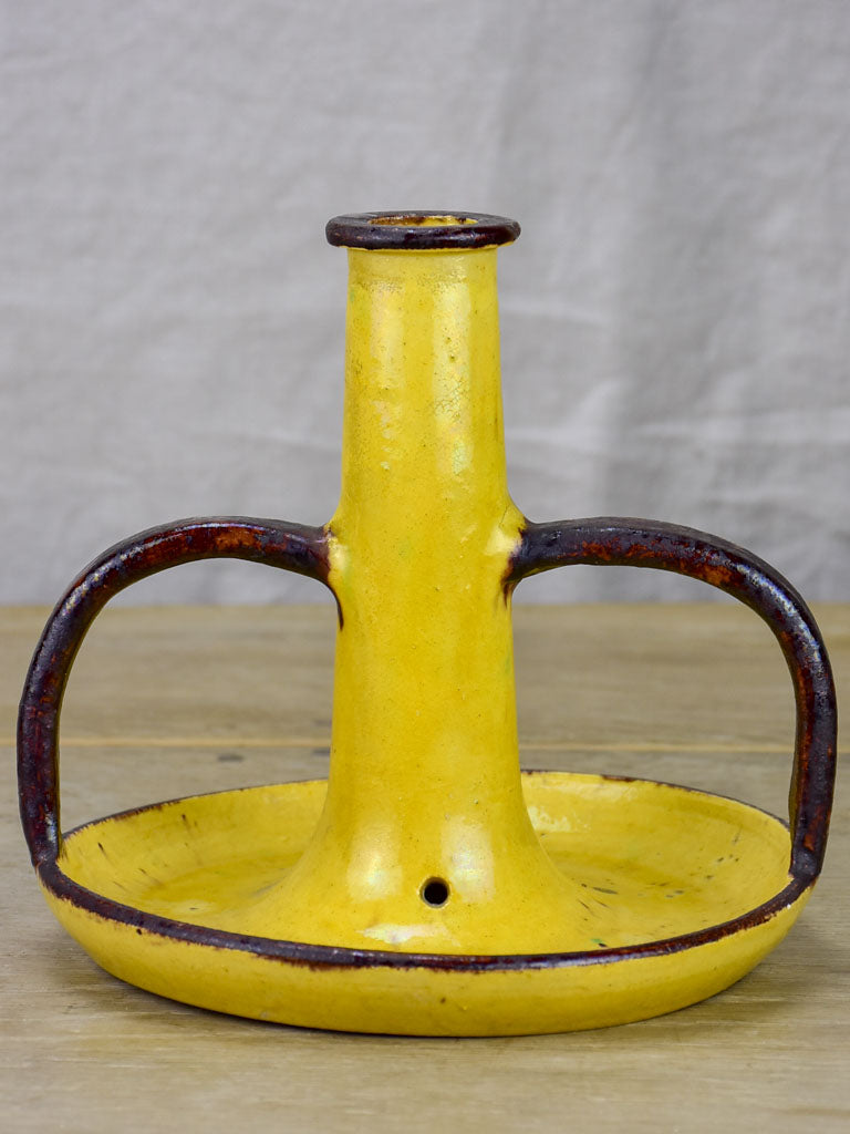 1930's Etienne Noel ceramic candlestick with yellow and brown glaze