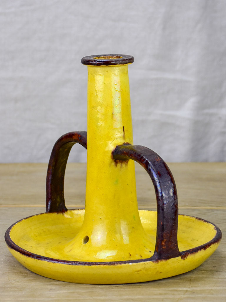 1930's Etienne Noel ceramic candlestick with yellow and brown glaze