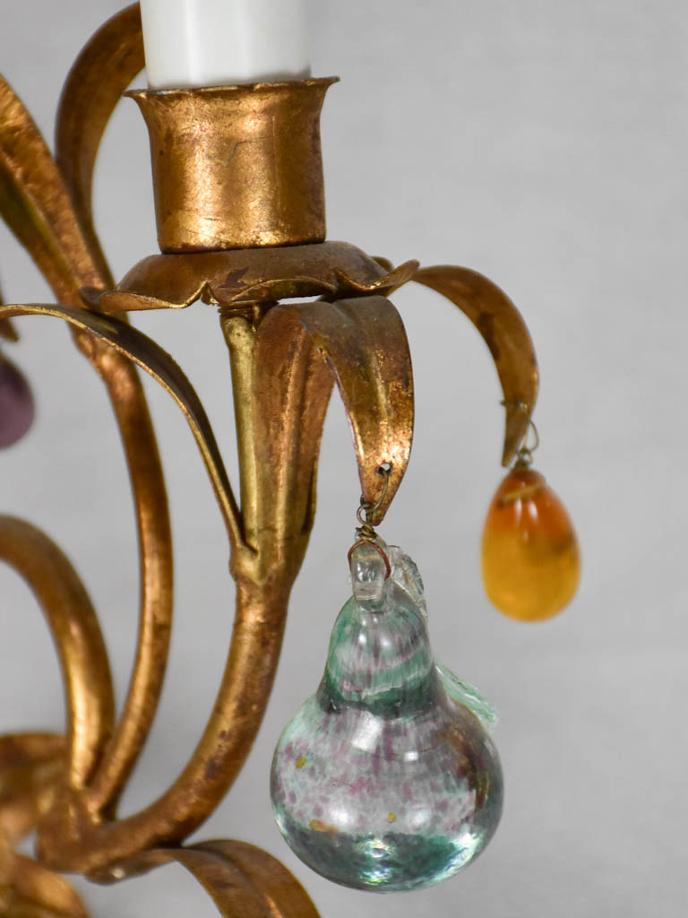 Three gold 1950s wall sconces with colorful glass fruits and pendants 13¾"