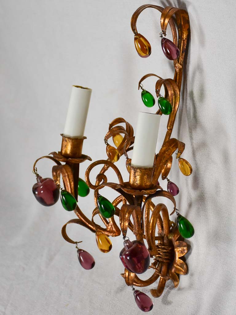 Three gold 1950s wall sconces with colorful glass fruits and pendants 13¾"