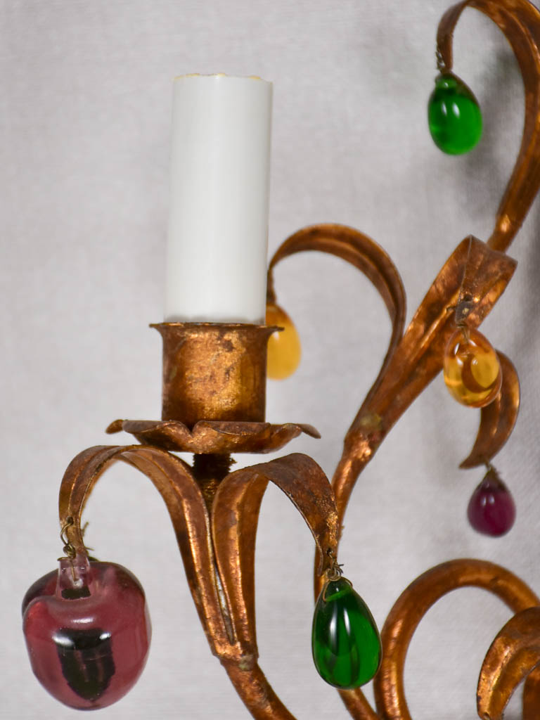 Three gold 1950s wall sconces with colorful glass fruits and pendants 13¾"