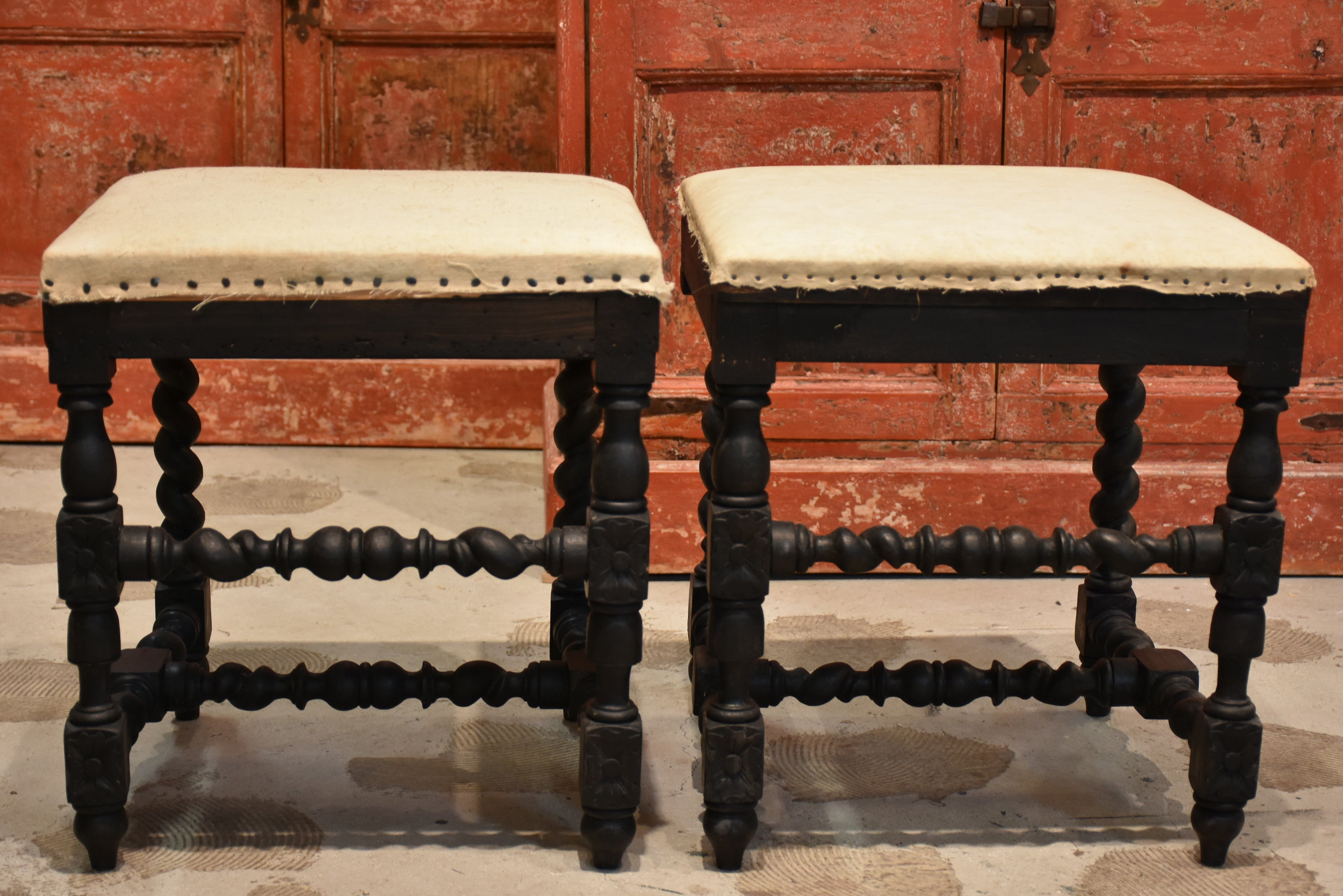 Pair of Louis XIII style stools with black patina