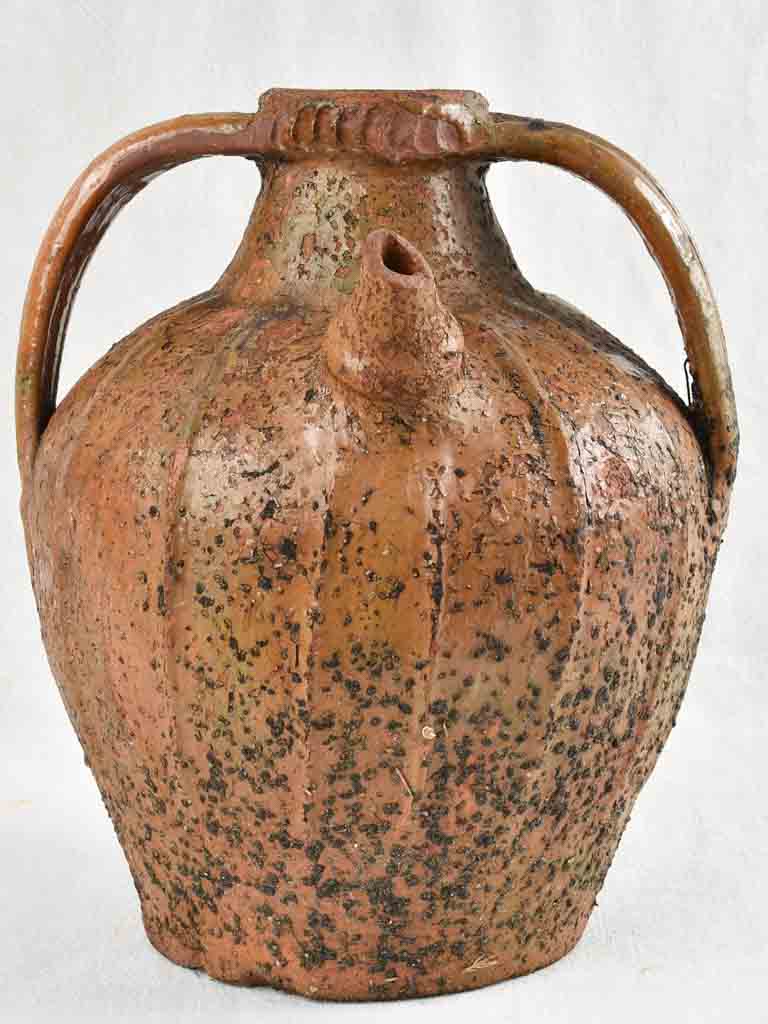 Antique French walnut oil pitcher from the Auvergne - terracotta - 15"