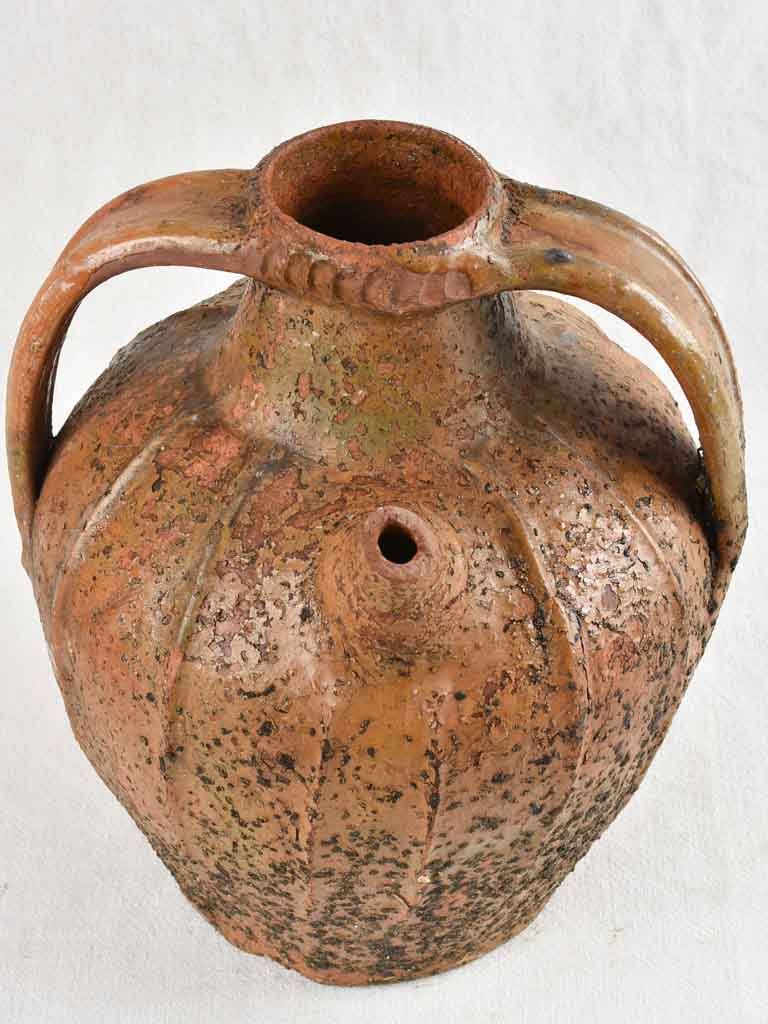 Antique French walnut oil pitcher from the Auvergne - terracotta - 15"