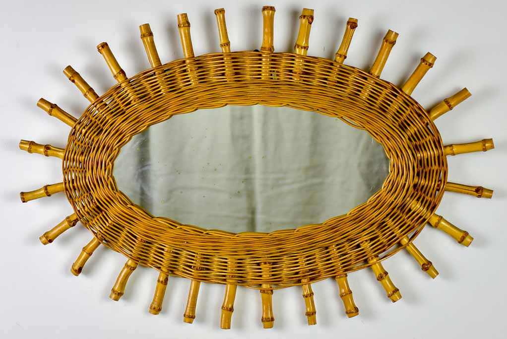 Vintage oval sunburst mirror - rattan and bamboo, 1970's 23¾ x 16¼""