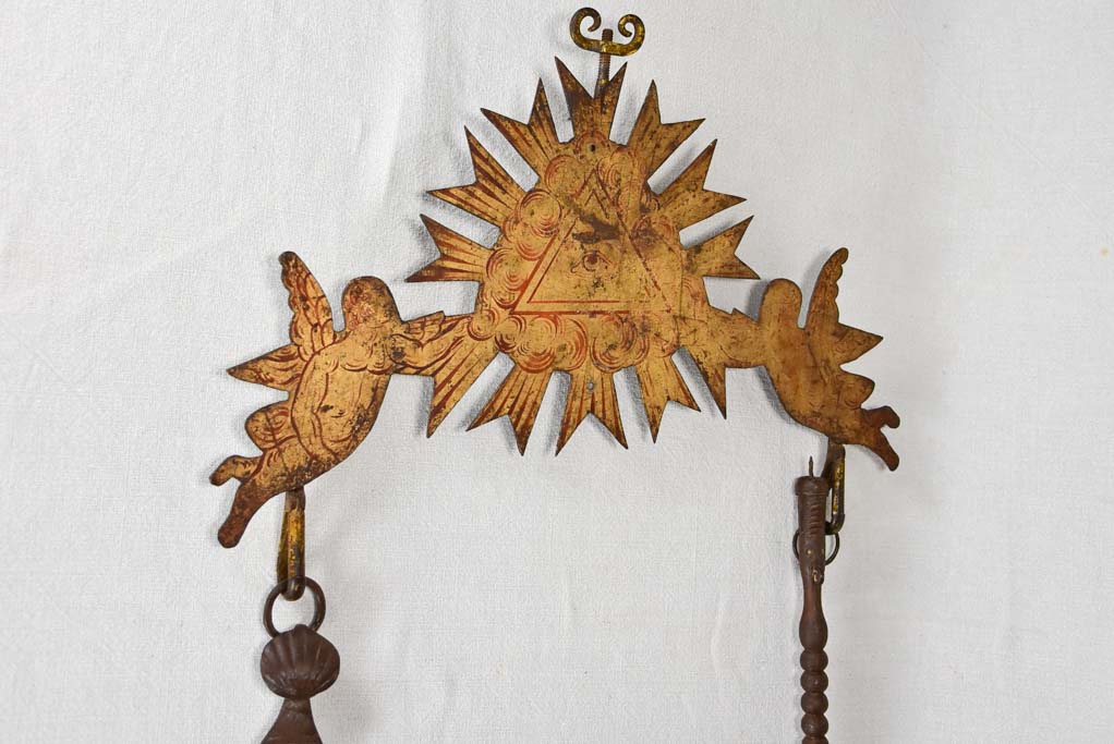 Historical cooking tools with sunburst design