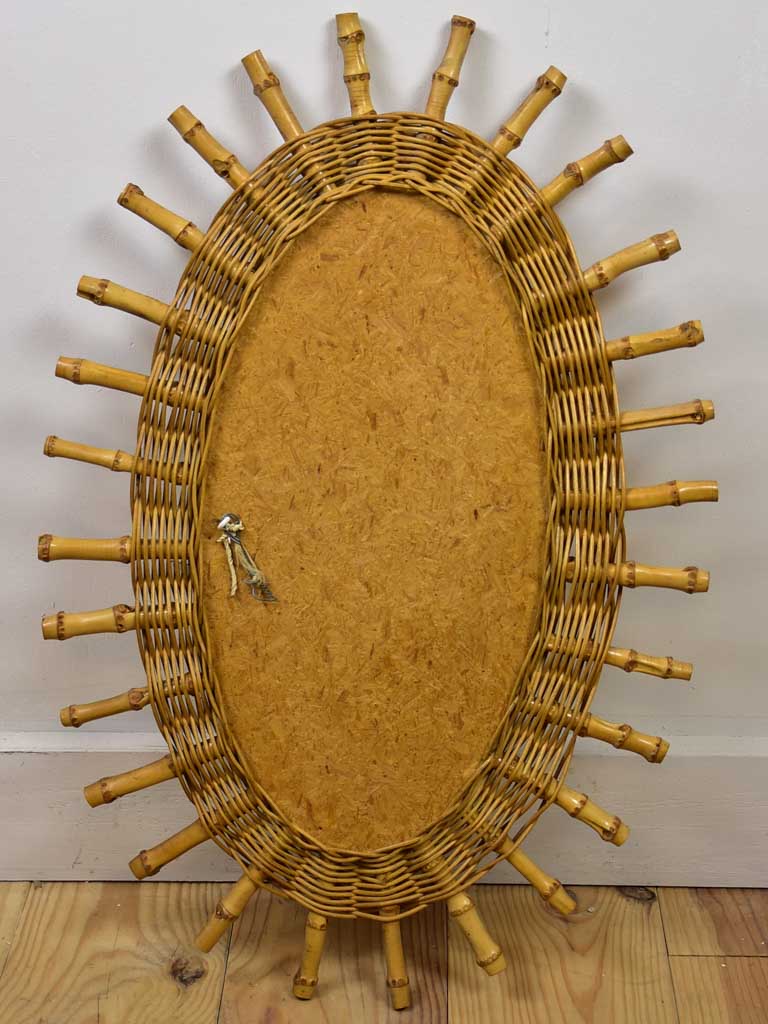 Vintage oval sunburst mirror - rattan and bamboo, 1970's 23¾ x 16¼""