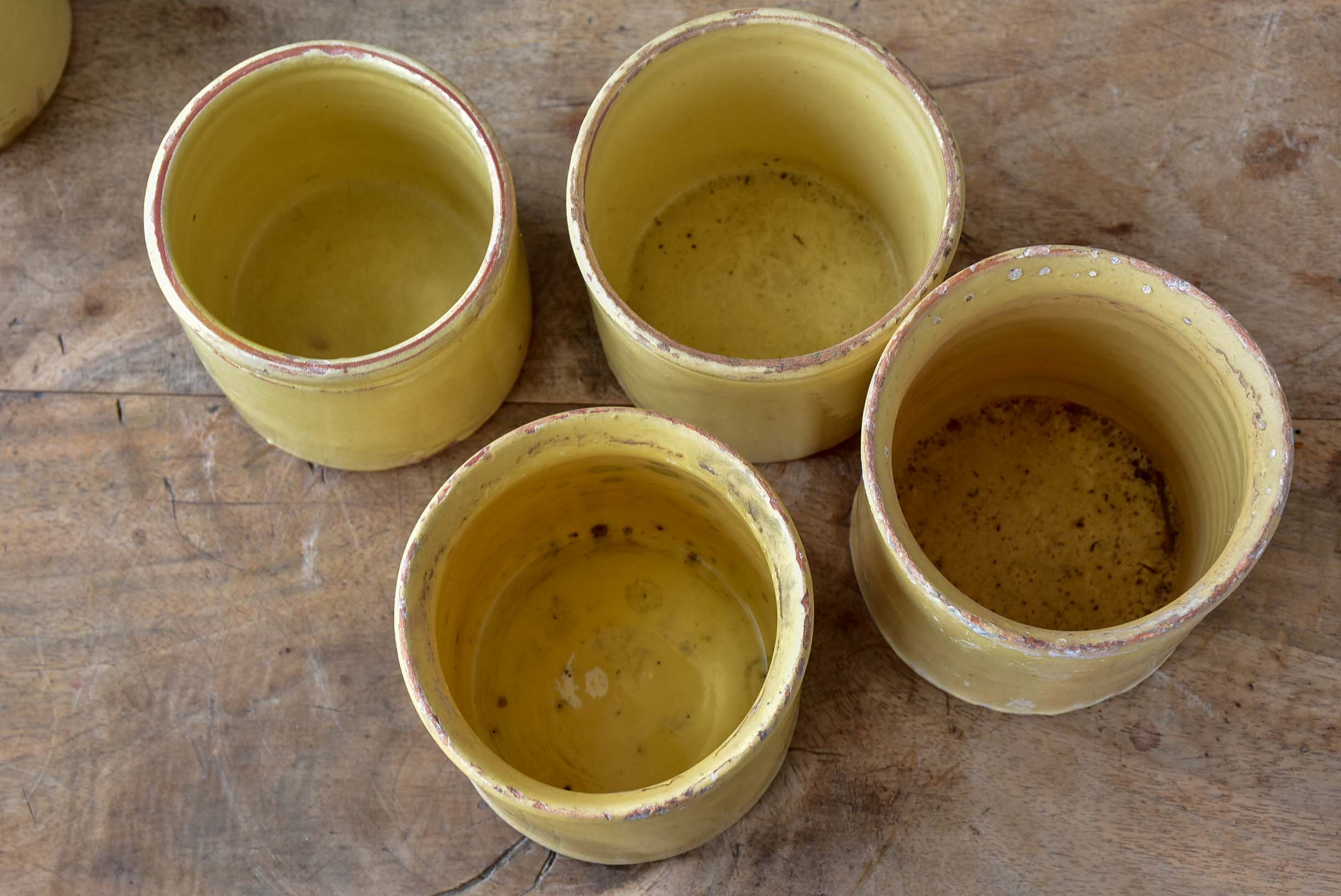 Collection of 7 antique French yellow ware pots