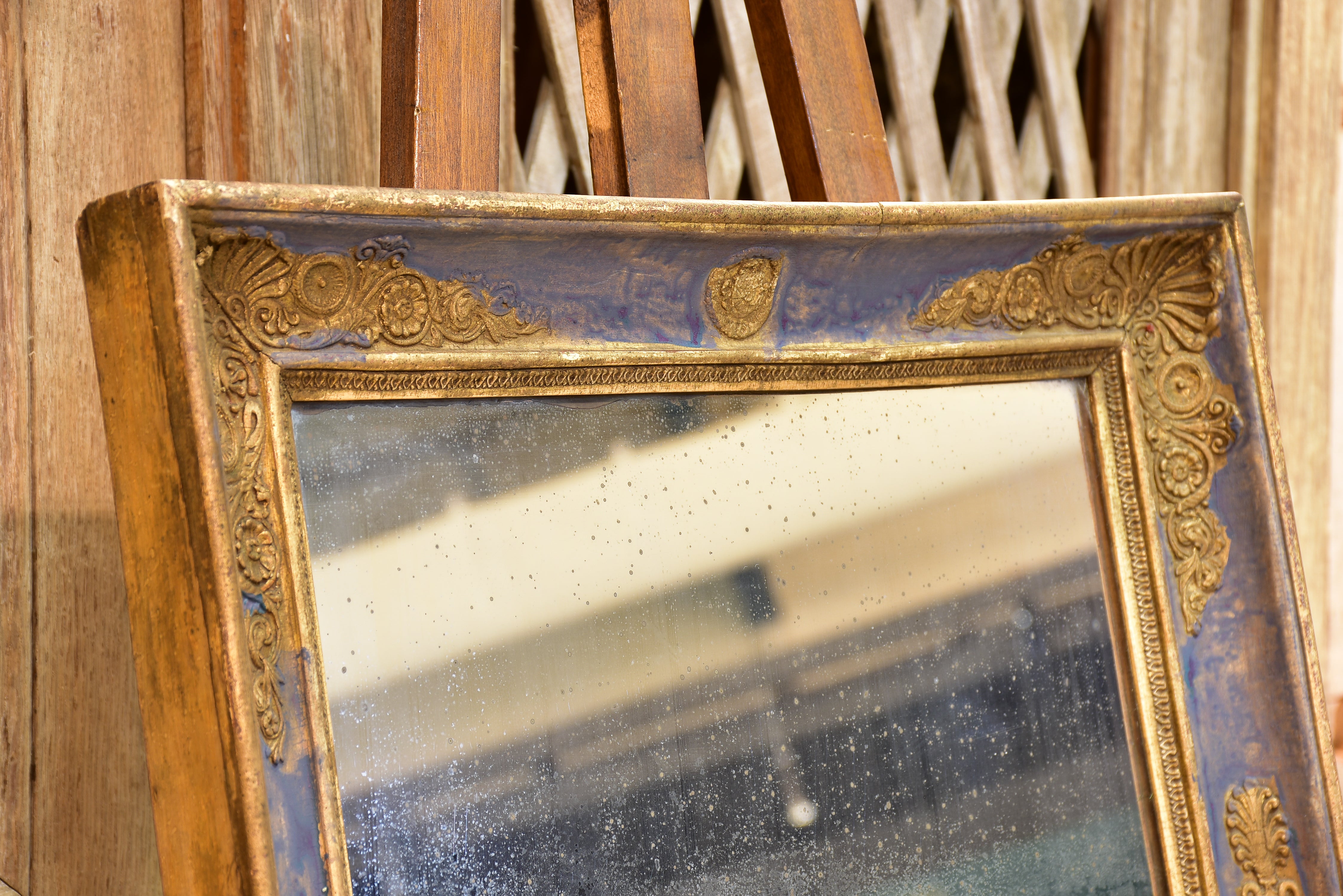 Early 19th century French restoration mirror with blue patina