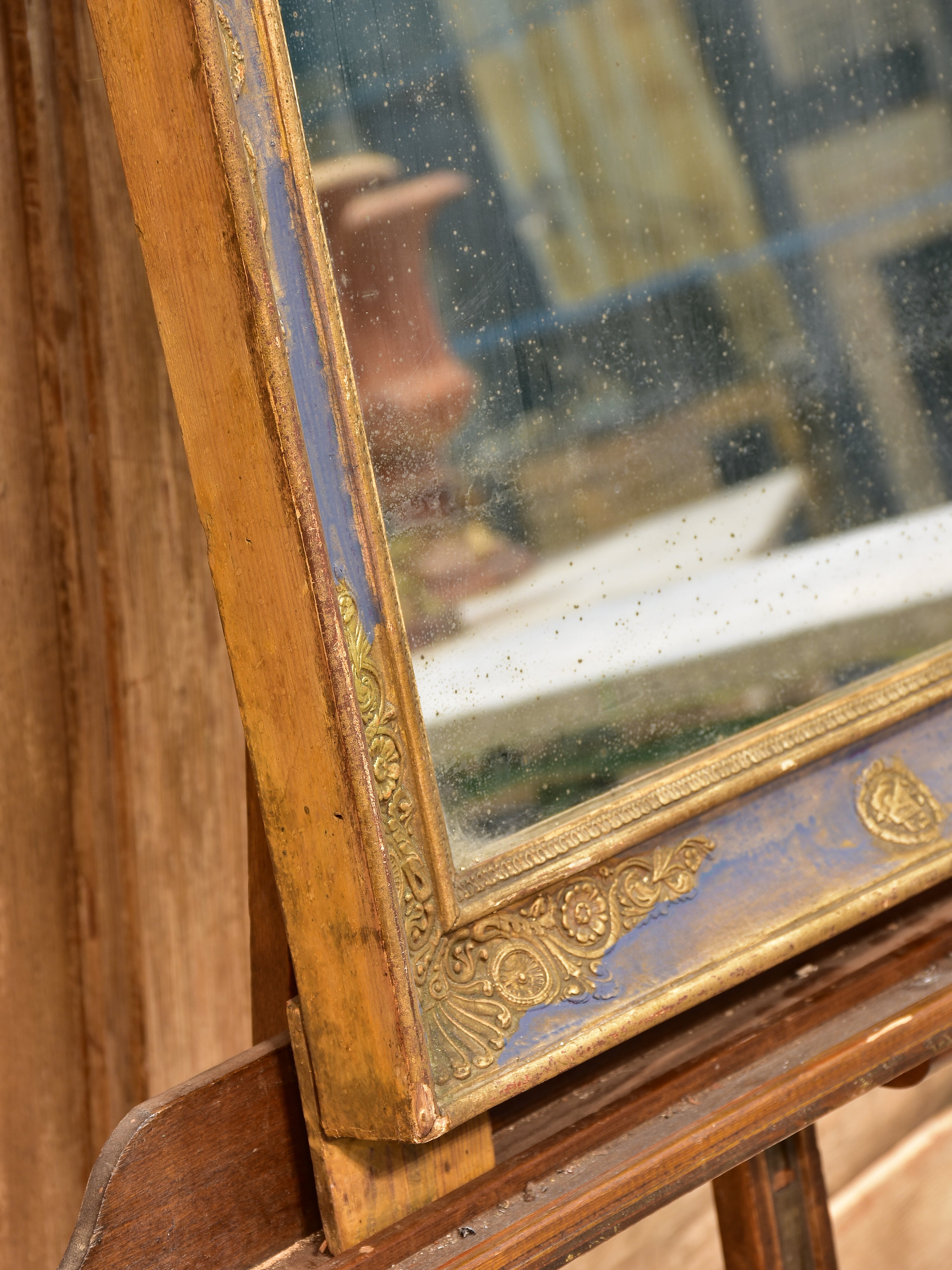 Early 19th century French restoration mirror with blue patina