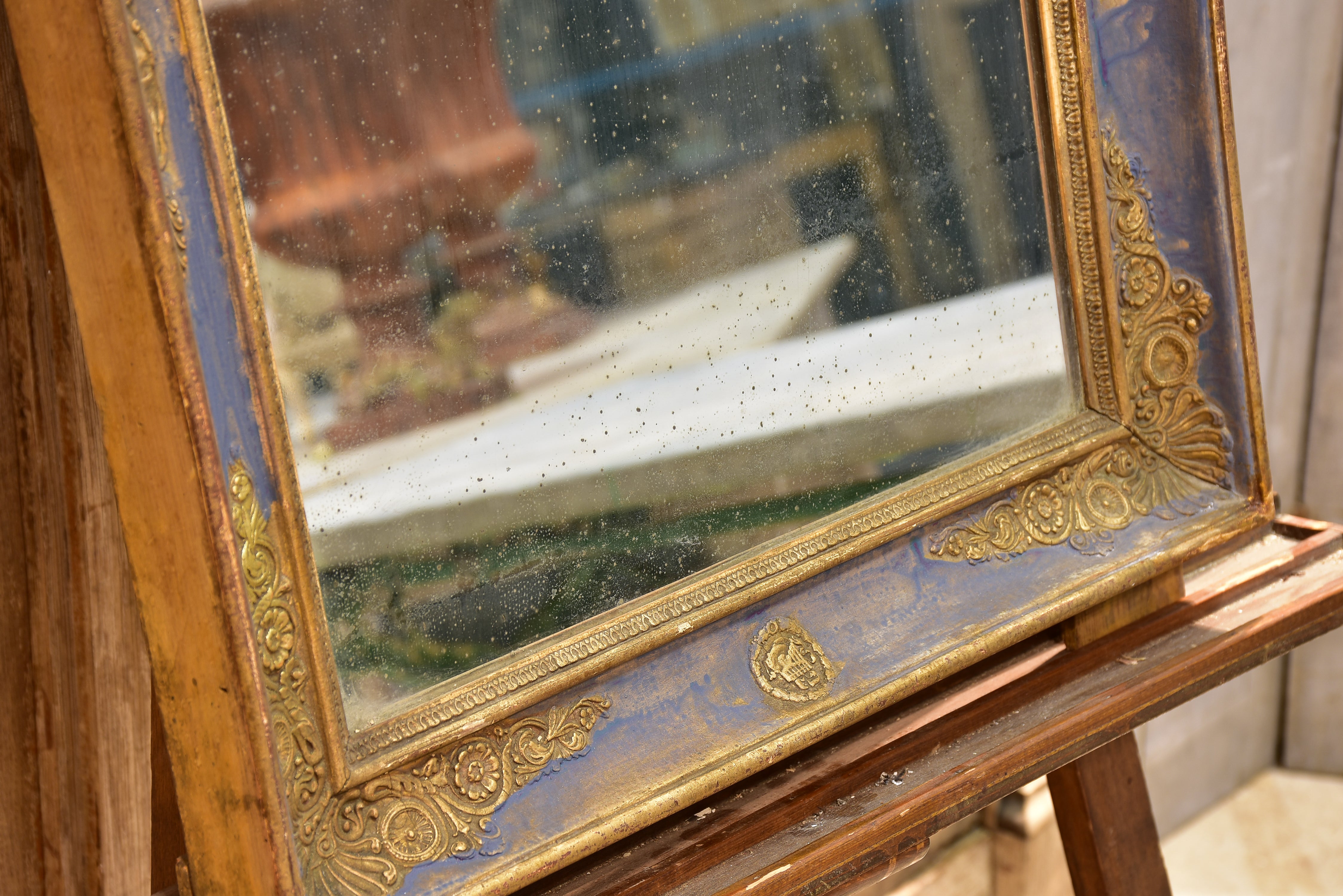 Early 19th century French restoration mirror with blue patina