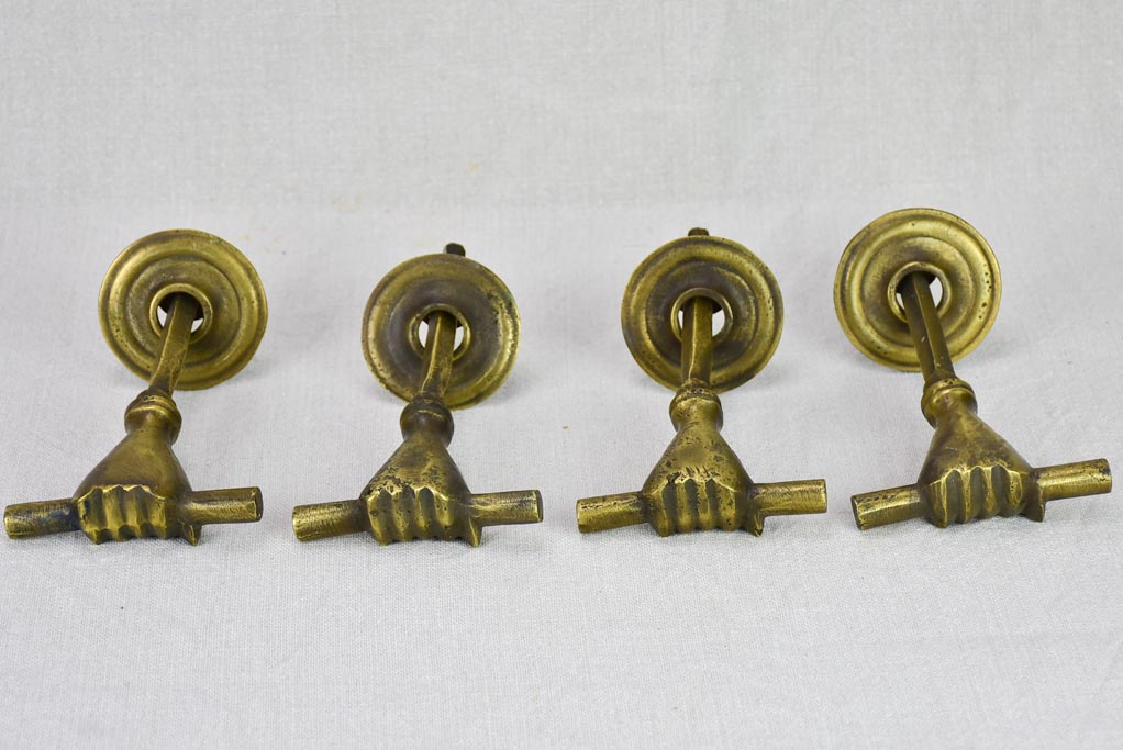 Four 19th Century english door handles in the shape of hands