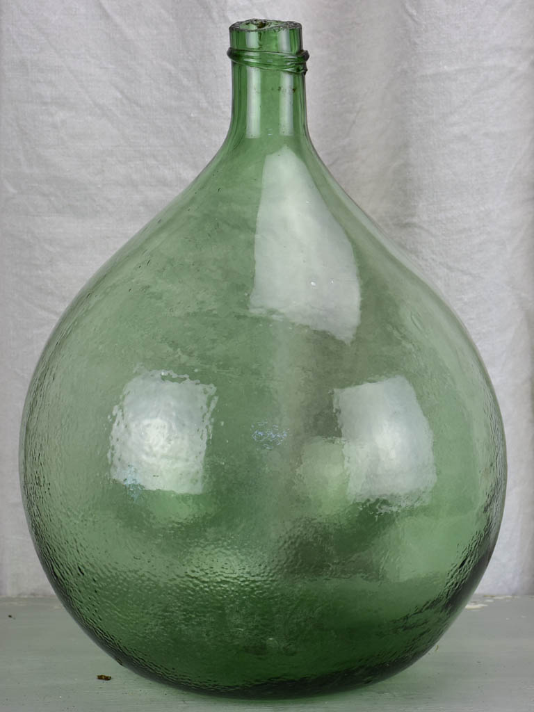 Large antique French demijohn - green