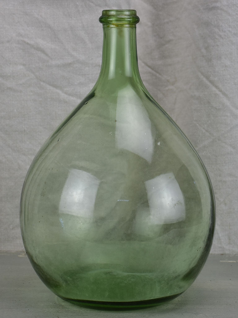 Small antique French demijohn bottle - green