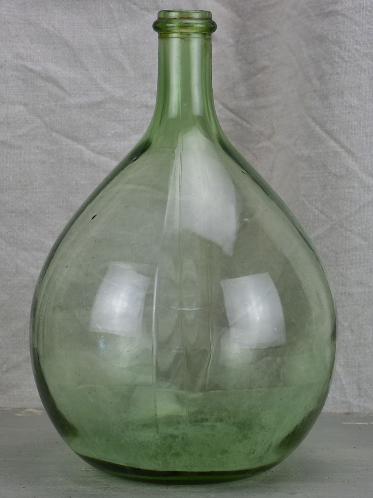 Small antique French demijohn bottle - green