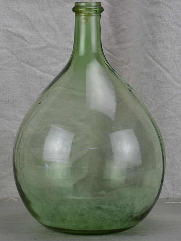 Small antique French demijohn bottle - green