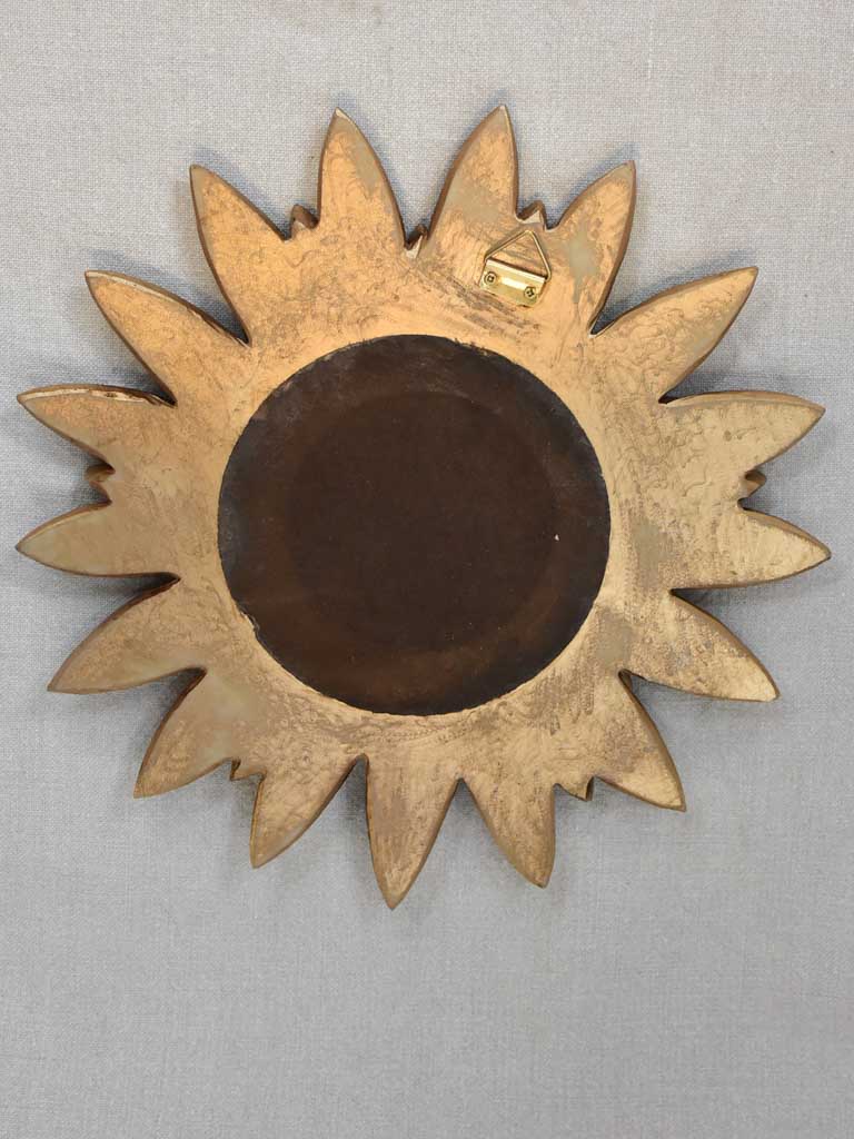 Vintage sunburst mirror with petal frame and convex glass 13"