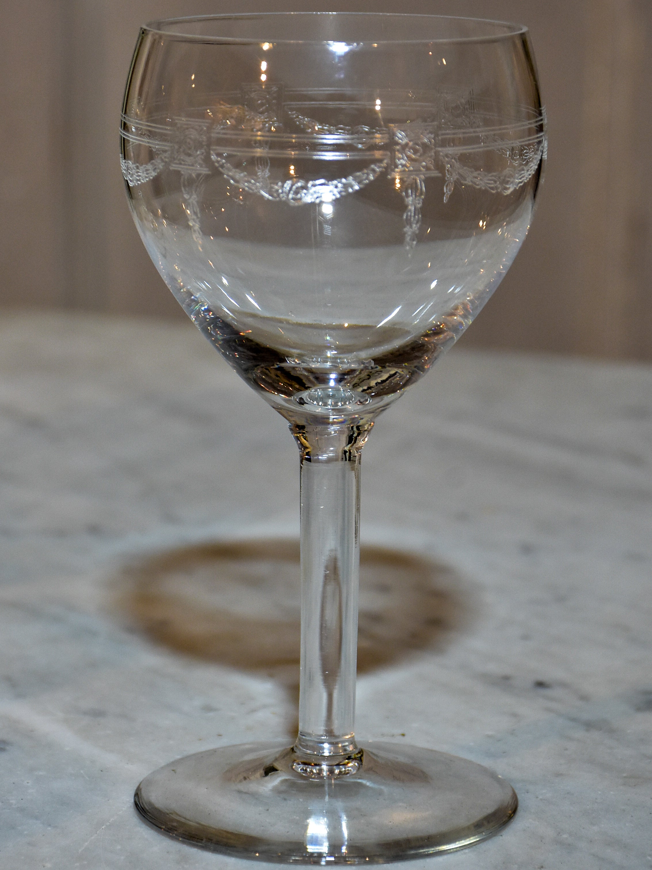 Six crystal wine glasses in the Louis XV style