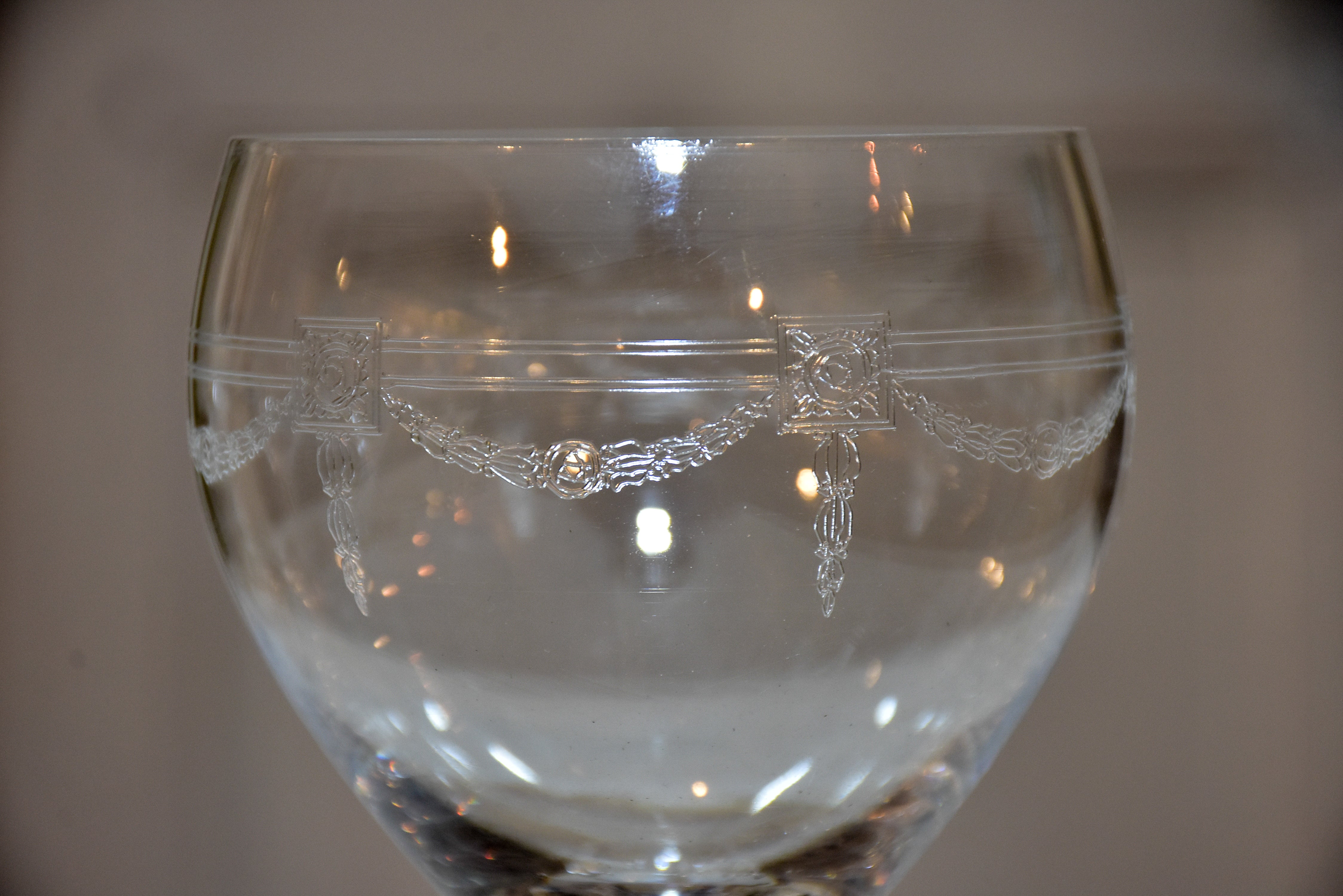 Six crystal wine glasses in the Louis XV style