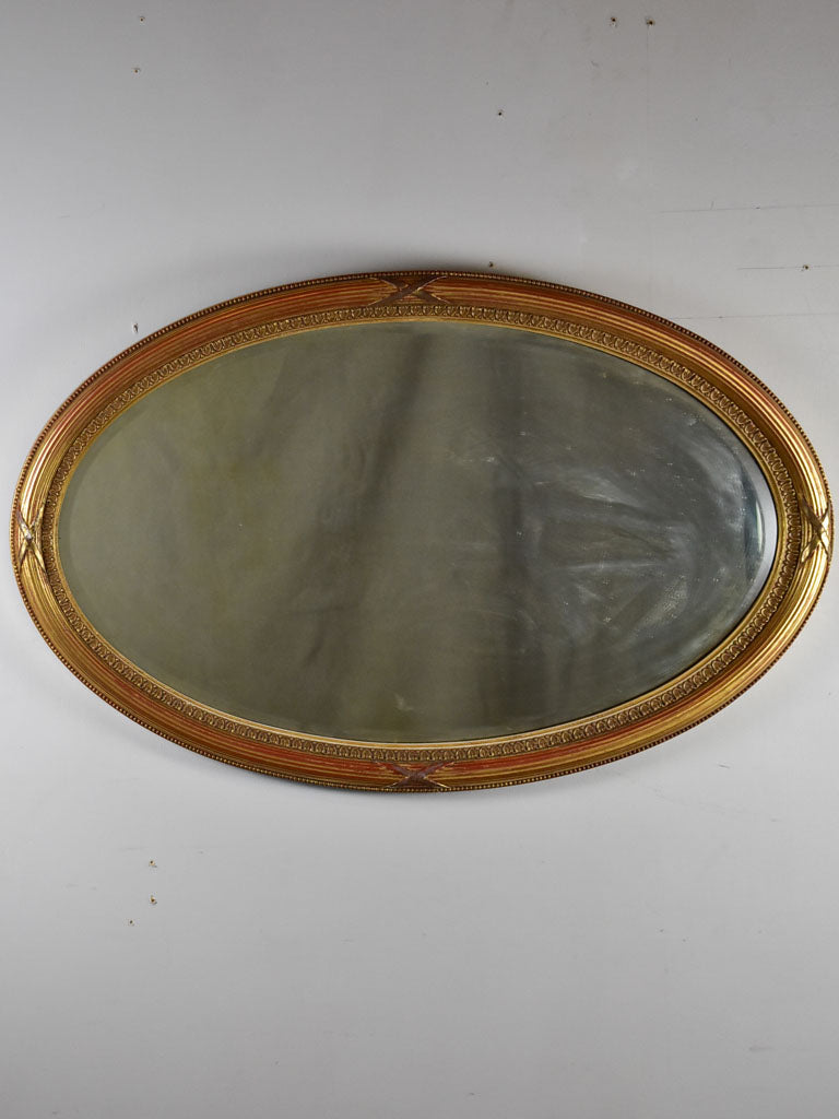 Early twentieth-century oval French mirror with bronzed glass 34¼" x 21¾"