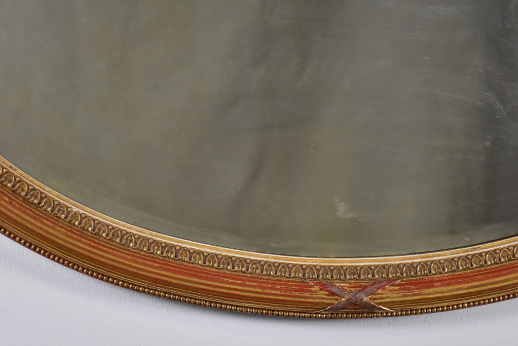 Early twentieth-century oval French mirror with bronzed glass 34¼" x 21¾"