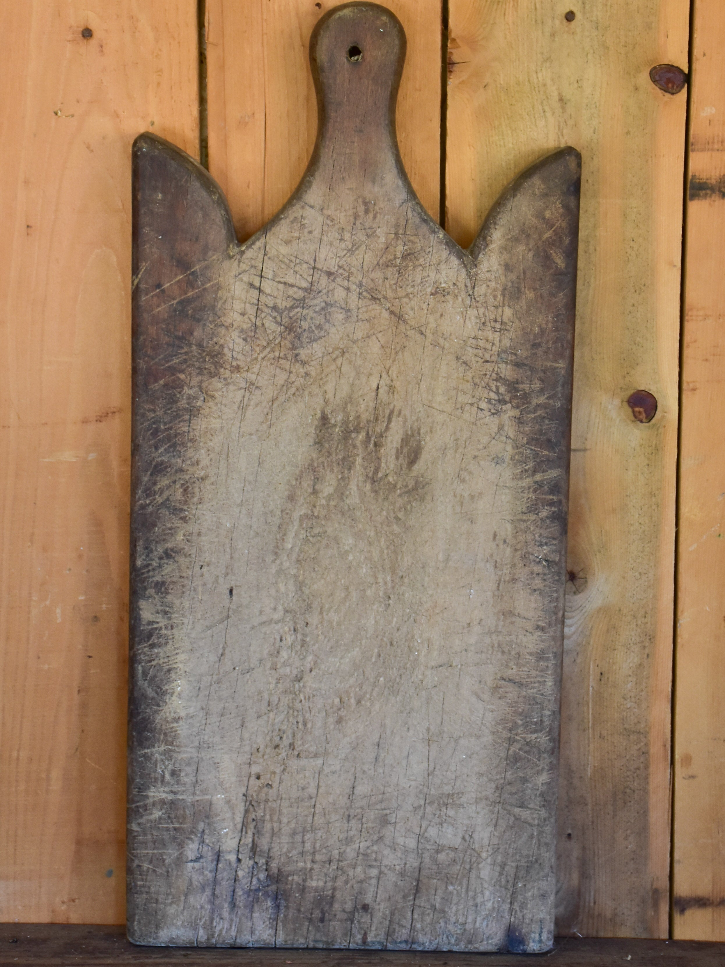 Large antique French cutting board with curved shoulders