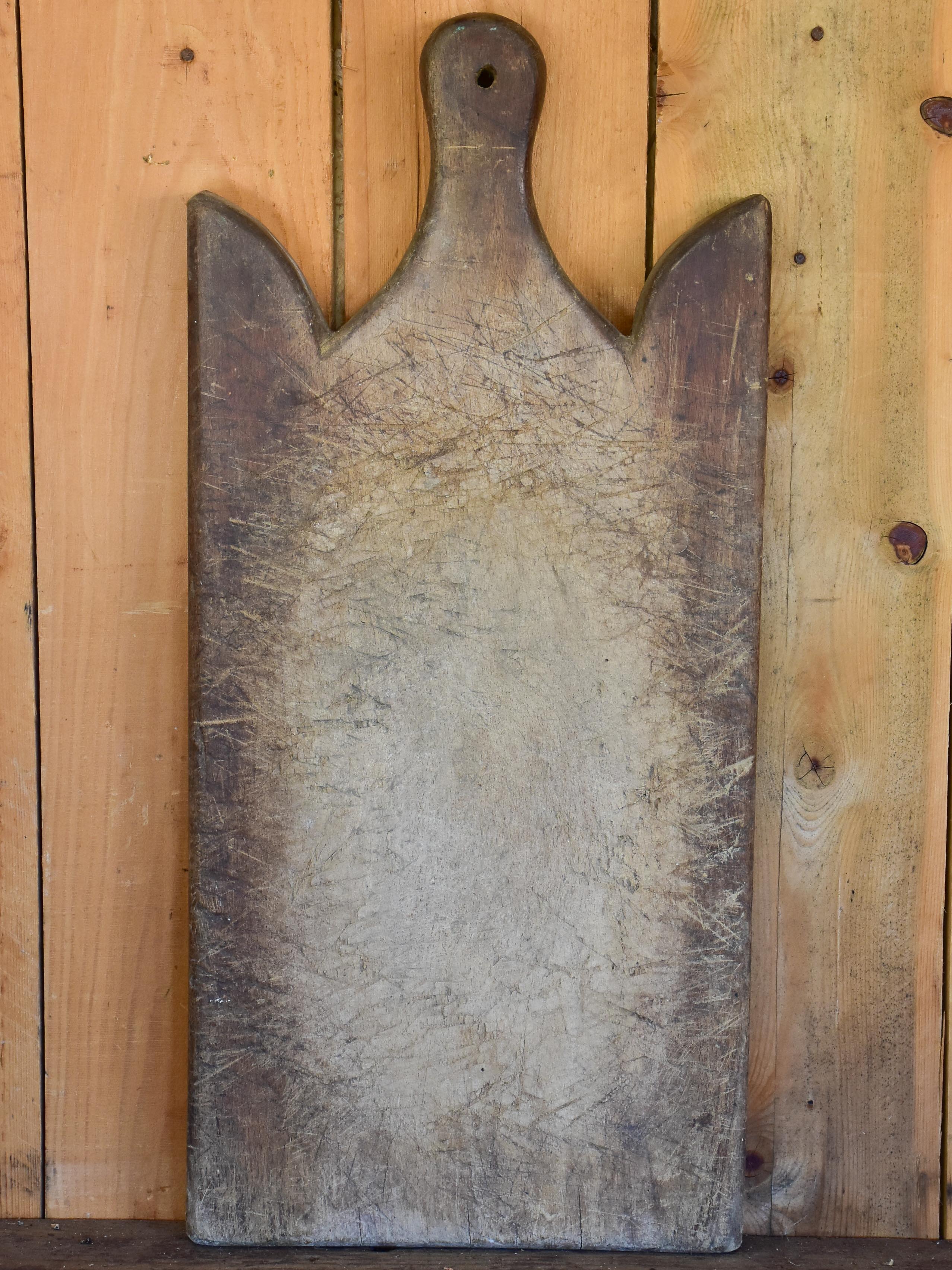 Large antique French cutting board with curved shoulders