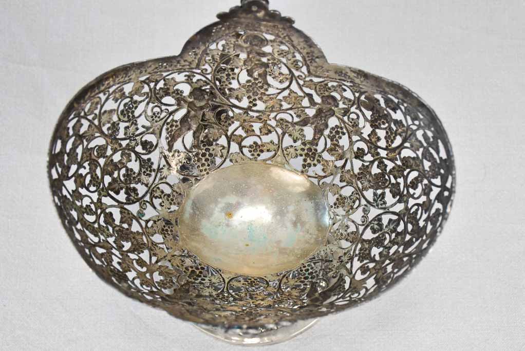 Antique lavishly decorated solid silver basket