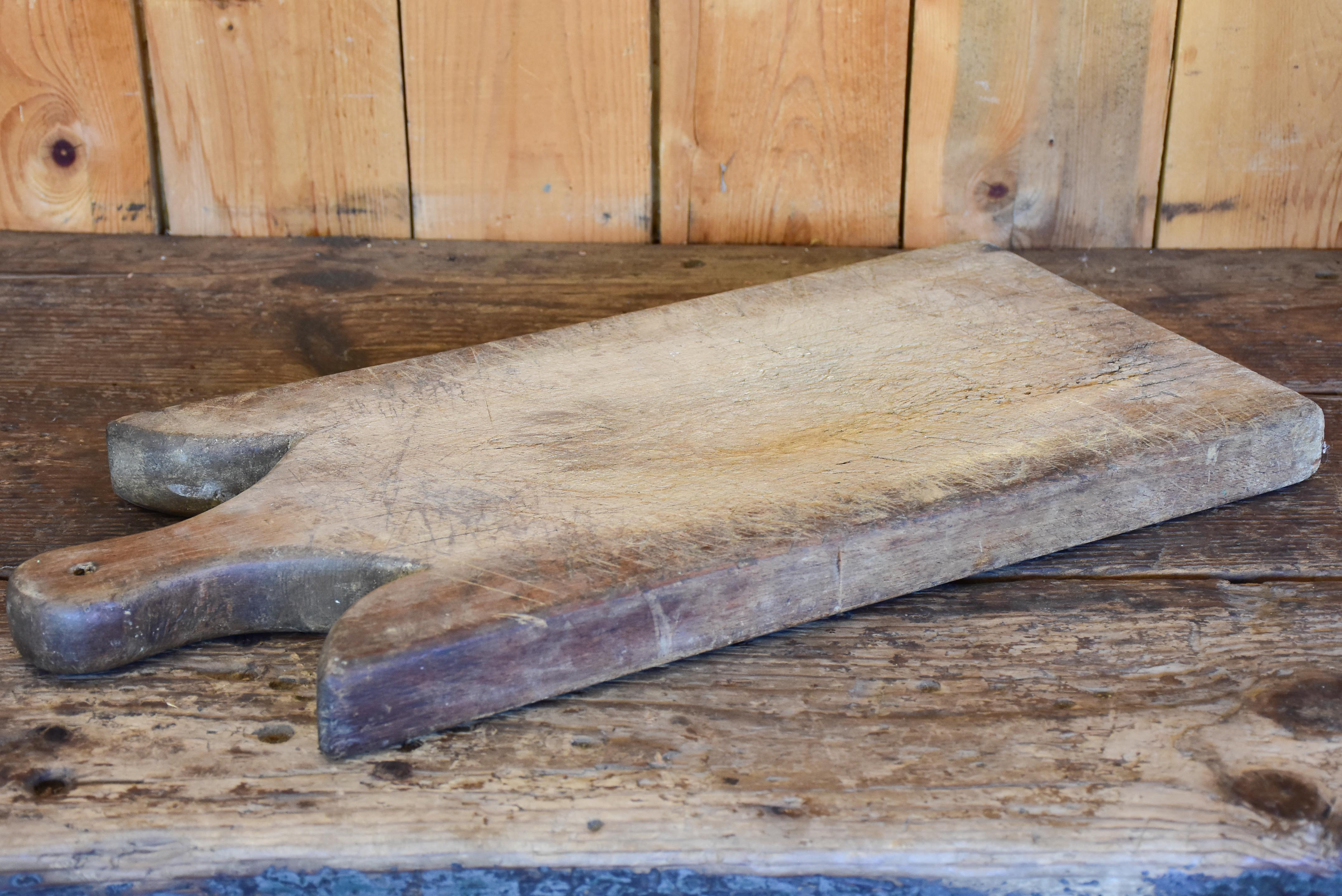 Large antique French cutting board with curved shoulders