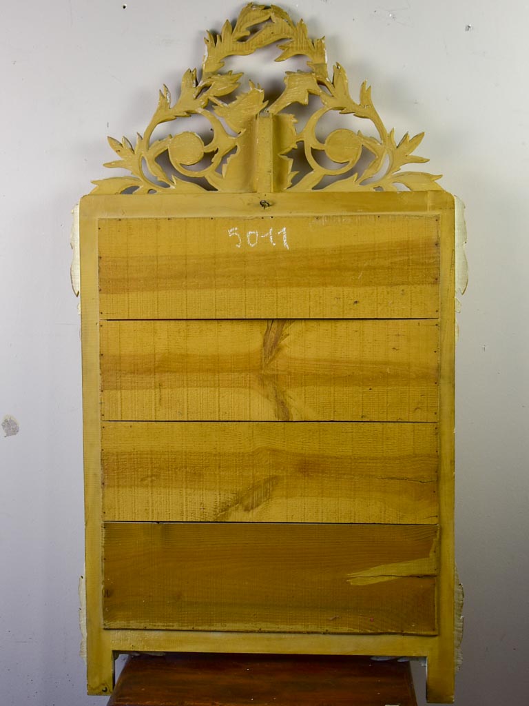 Louis XVI-style gilded mirror with musical floral crest and motifs 26½" x 46¾"