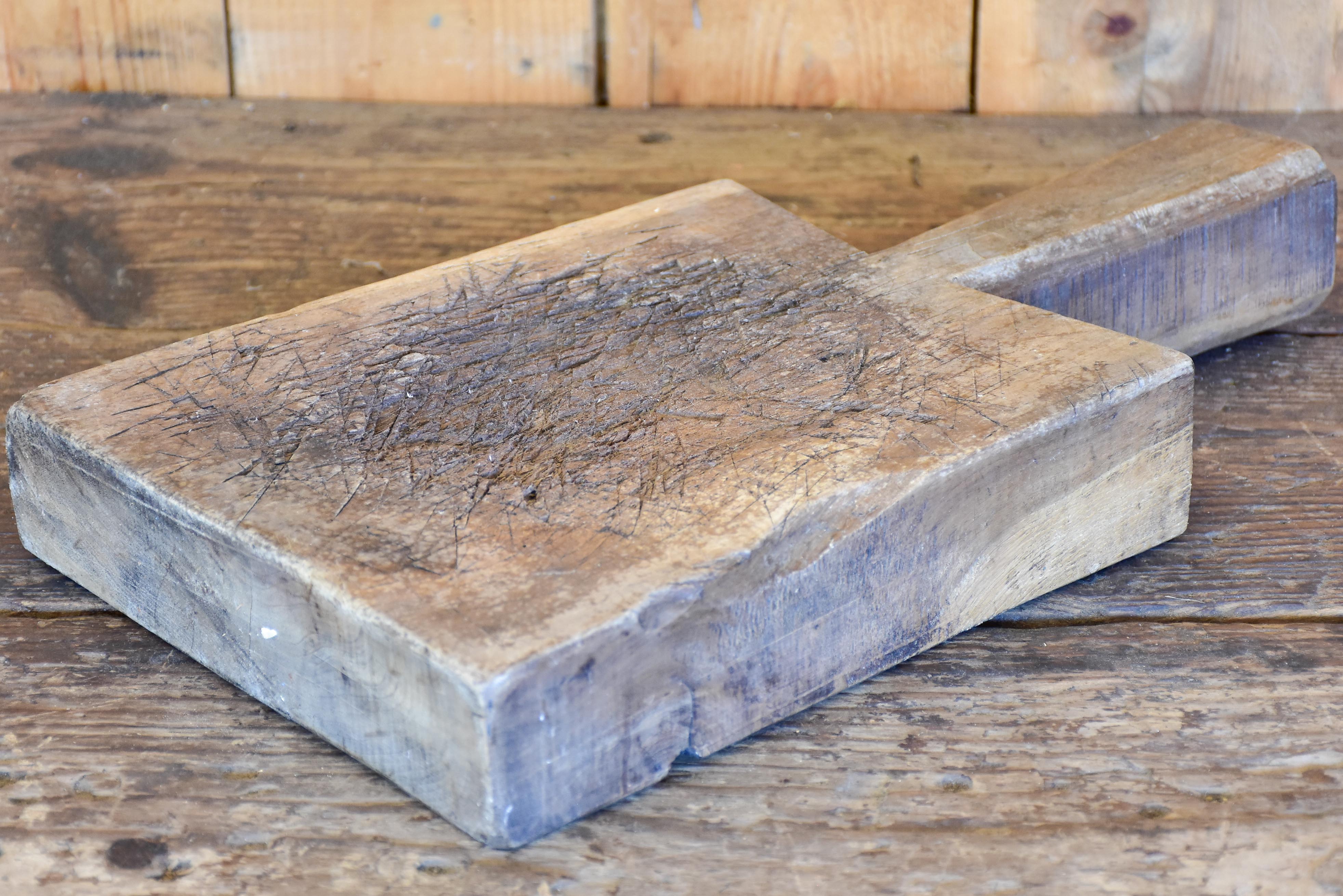 Very thick antique French cutting board with long handle