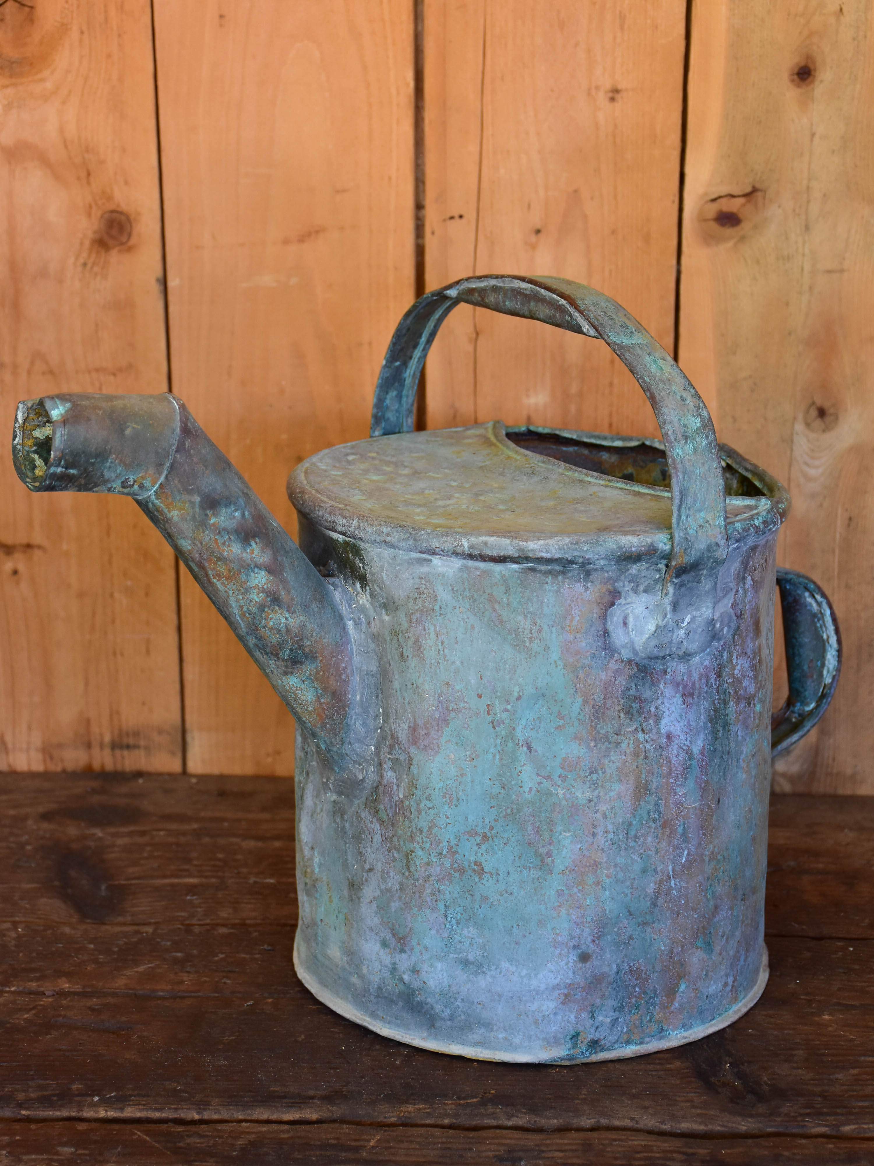 Antique French watering can with bent spout