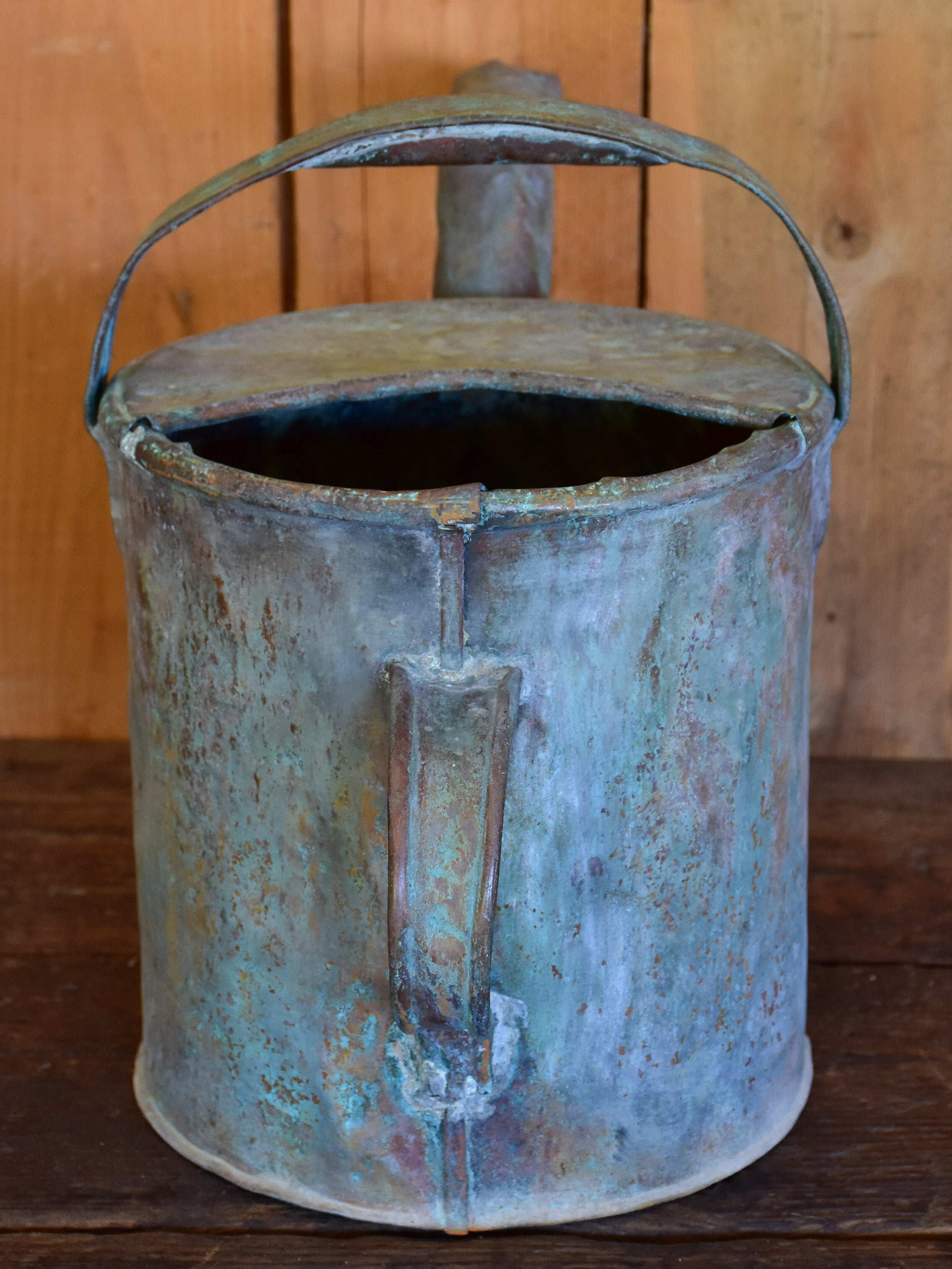 Antique French watering can with bent spout