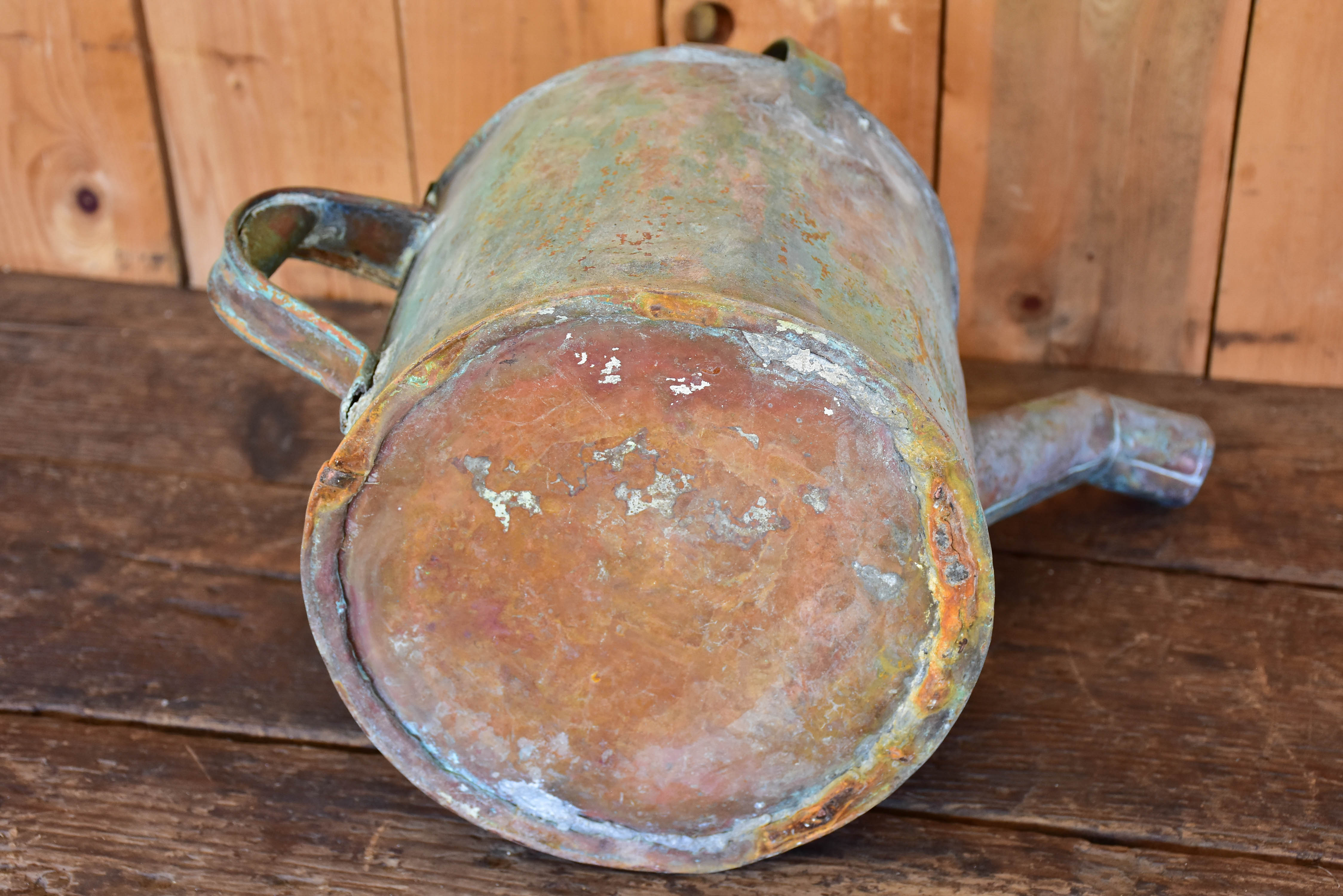 Antique French watering can with bent spout