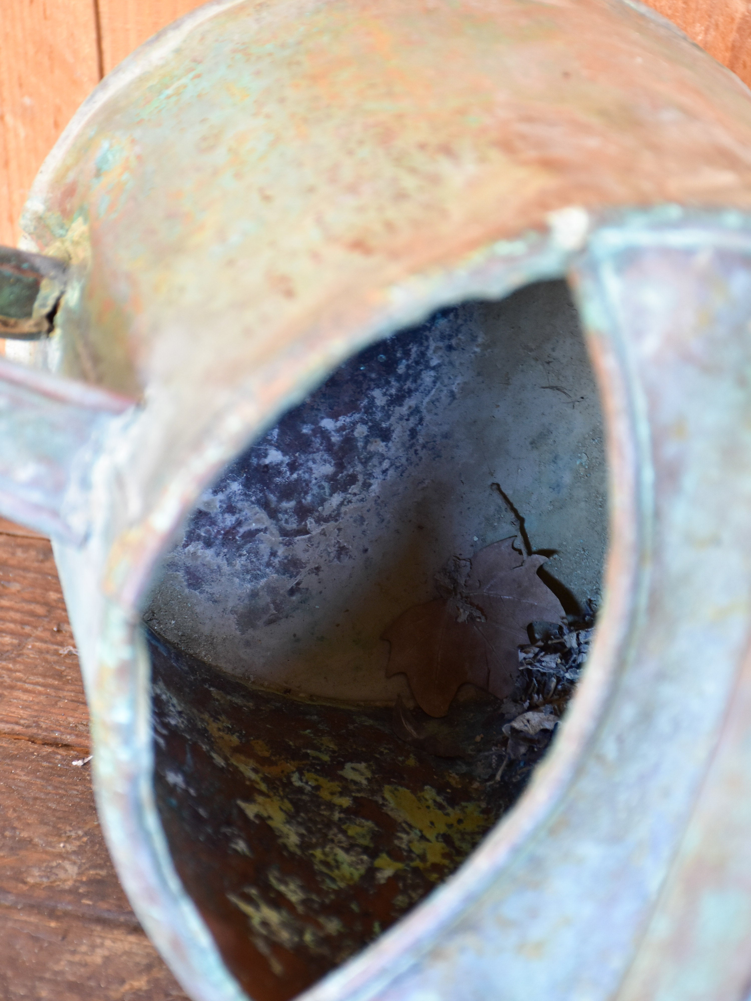 Antique French watering can with bent spout