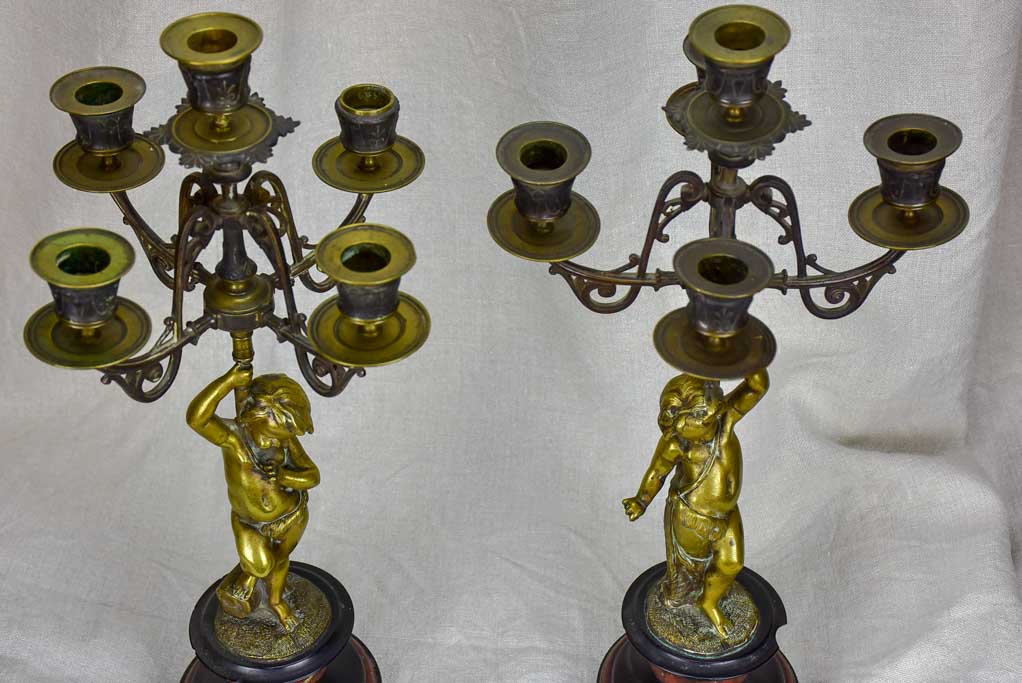 Pair of Napoleon III candlesticks with cherubs