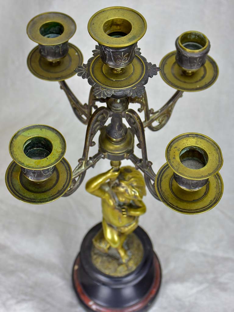 Pair of Napoleon III candlesticks with cherubs