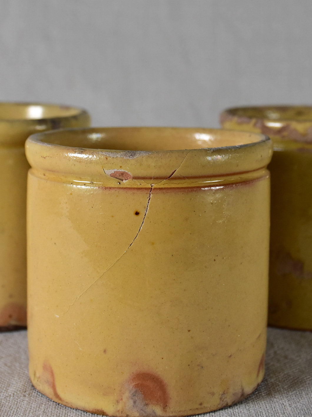 Three antique French yellow ware preserving jars 4"