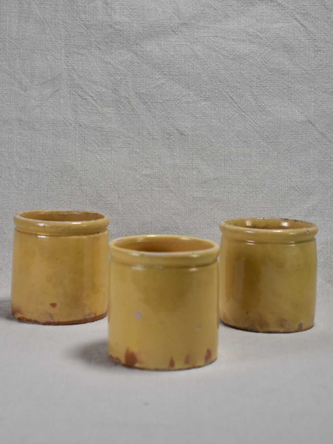 Three antique French yellow ware preserving jars 3½"