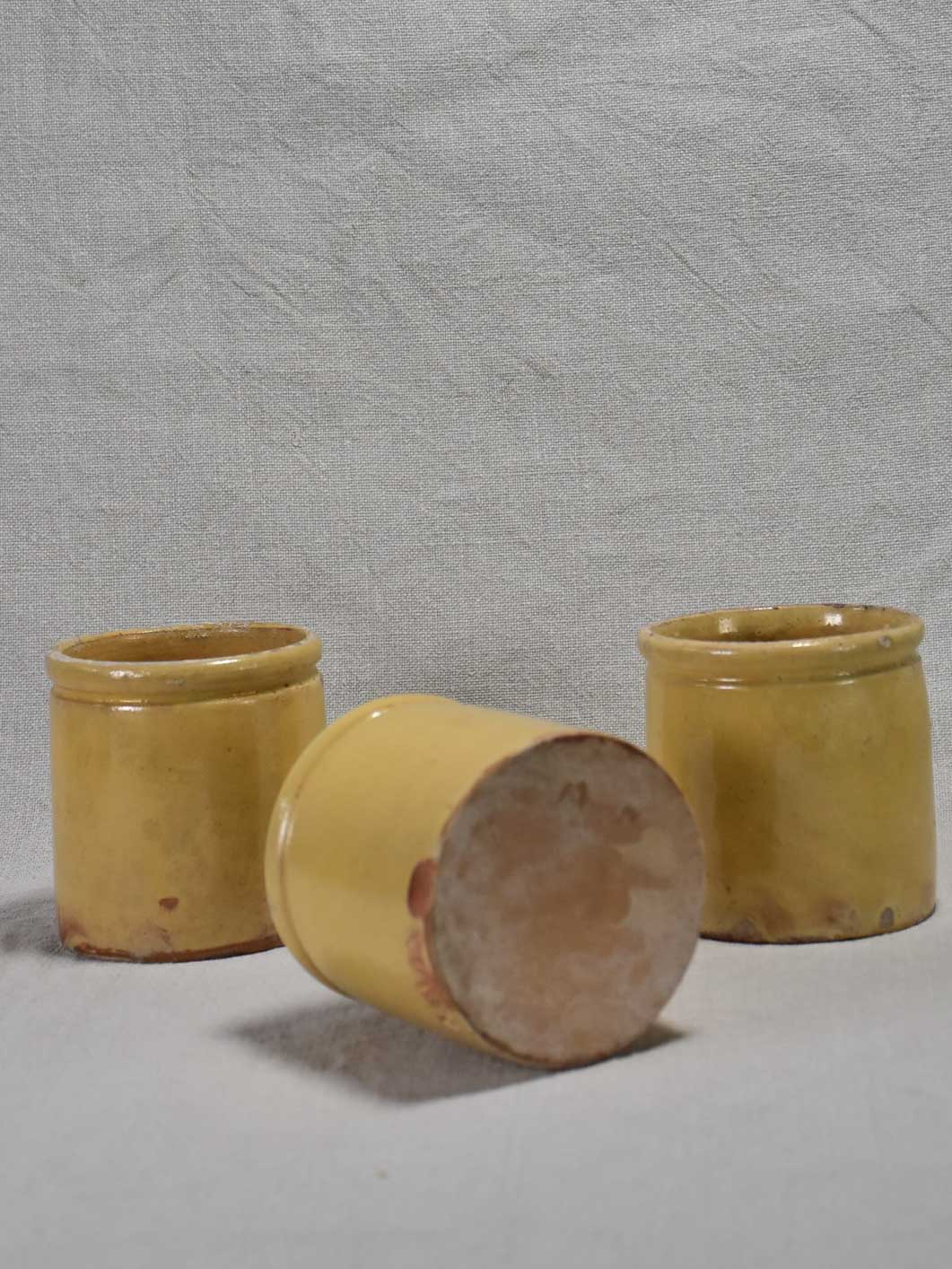 Three antique French yellow ware preserving jars 3½"