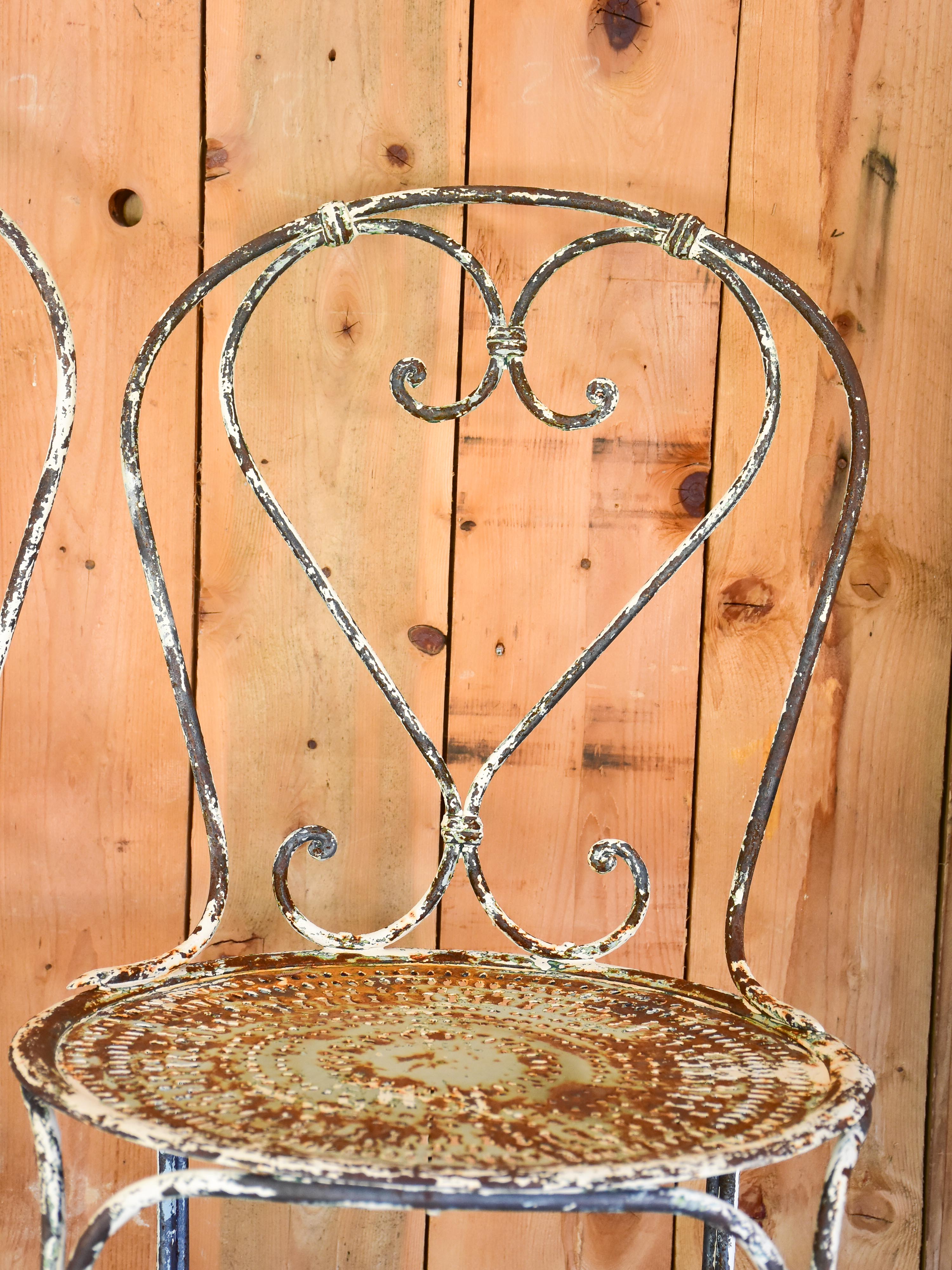 Pair of heart-backed antique French garden chairs