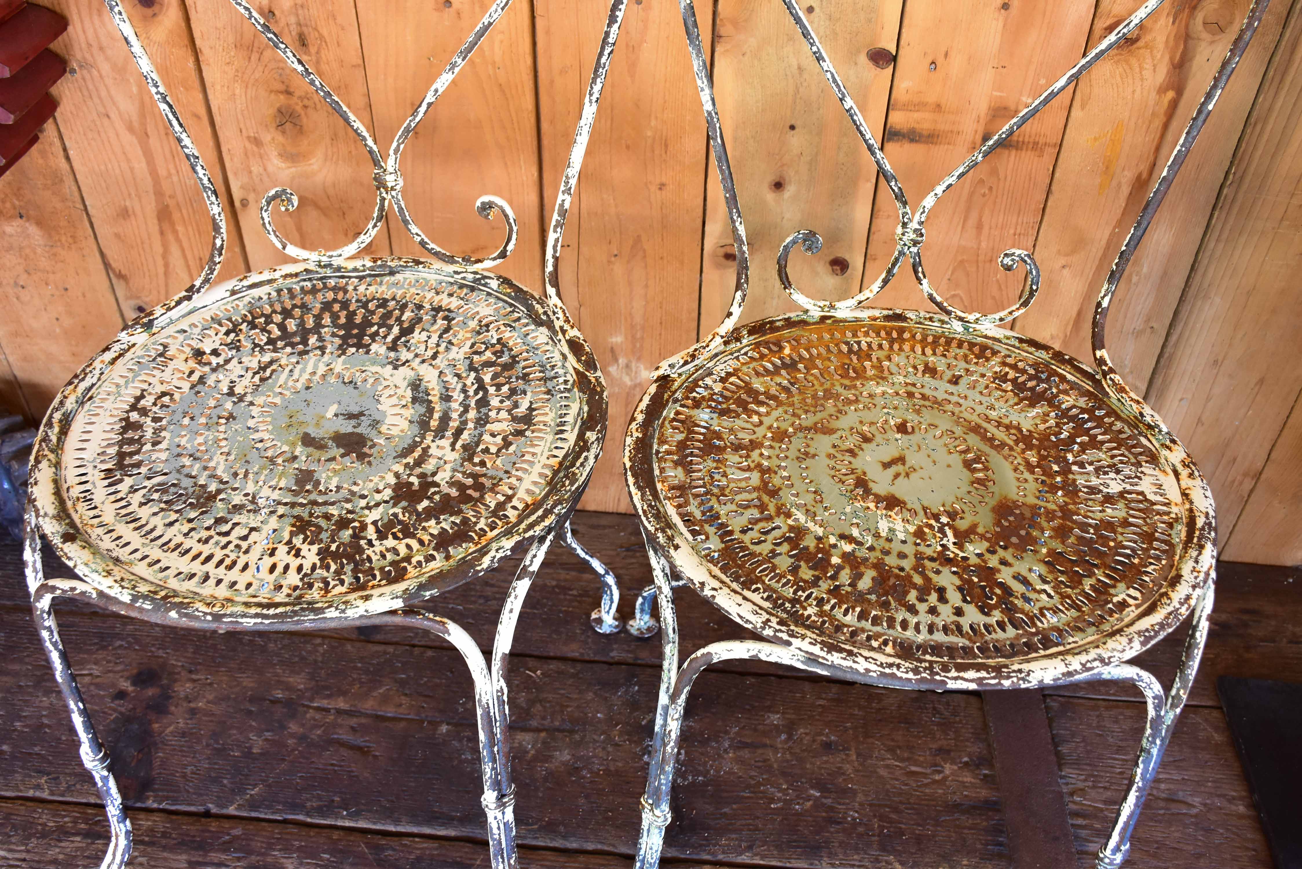 Pair of heart-backed antique French garden chairs