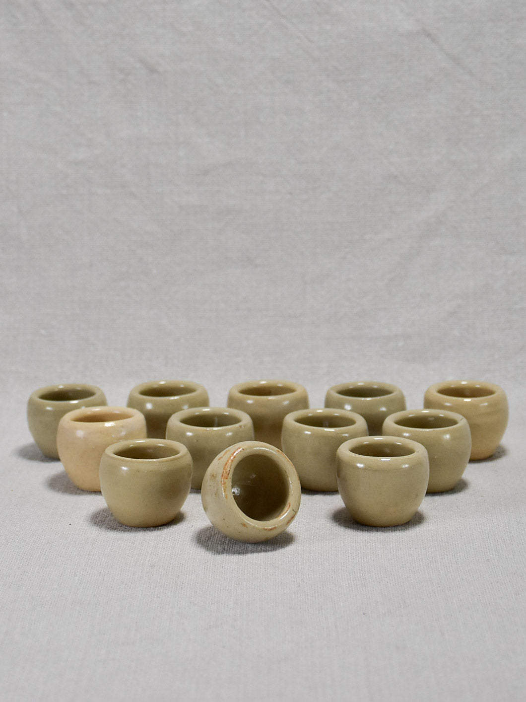 Collection of twelve vintage snail pots - gray glaze 1¼"