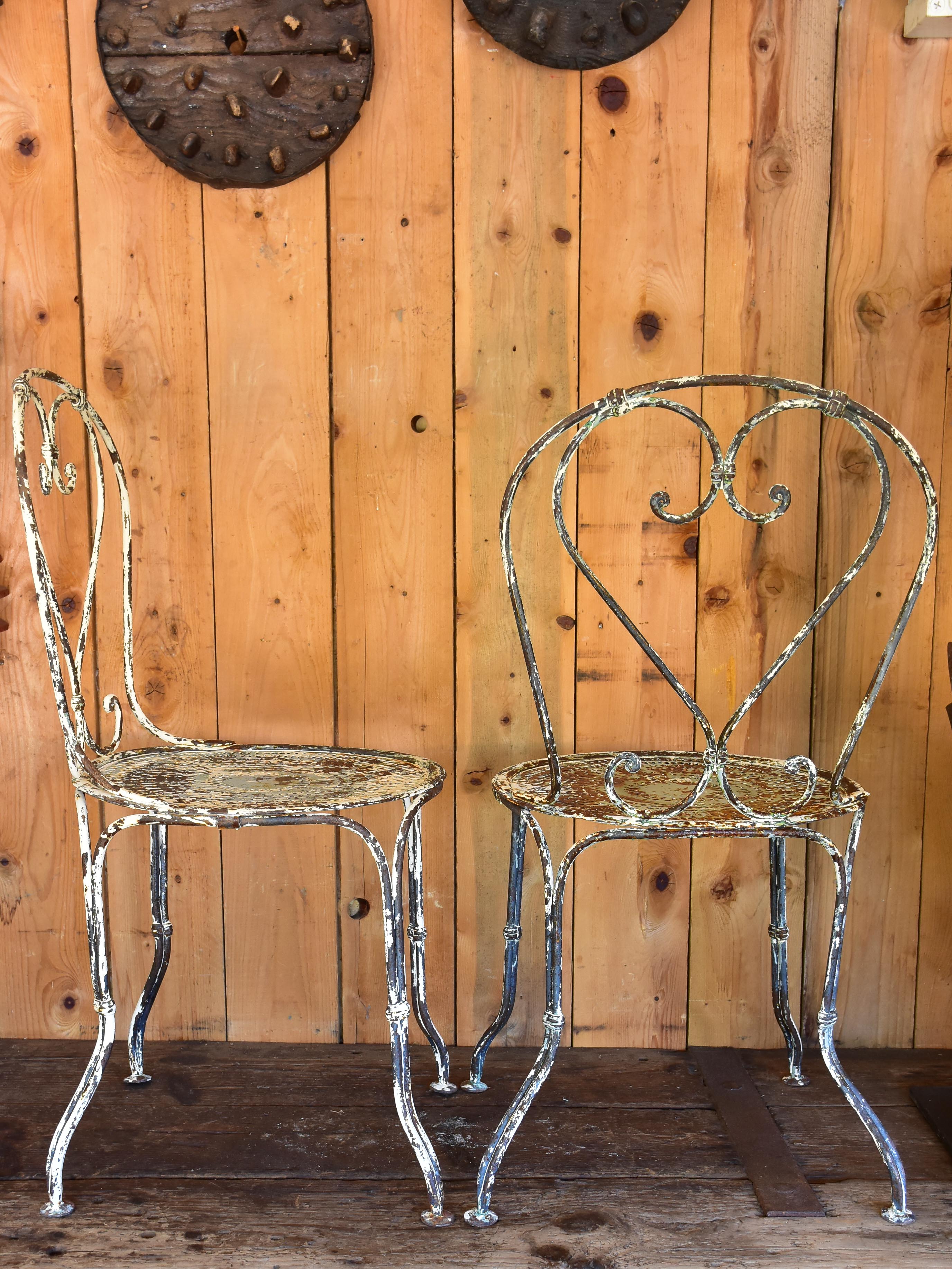 Pair of heart-backed antique French garden chairs