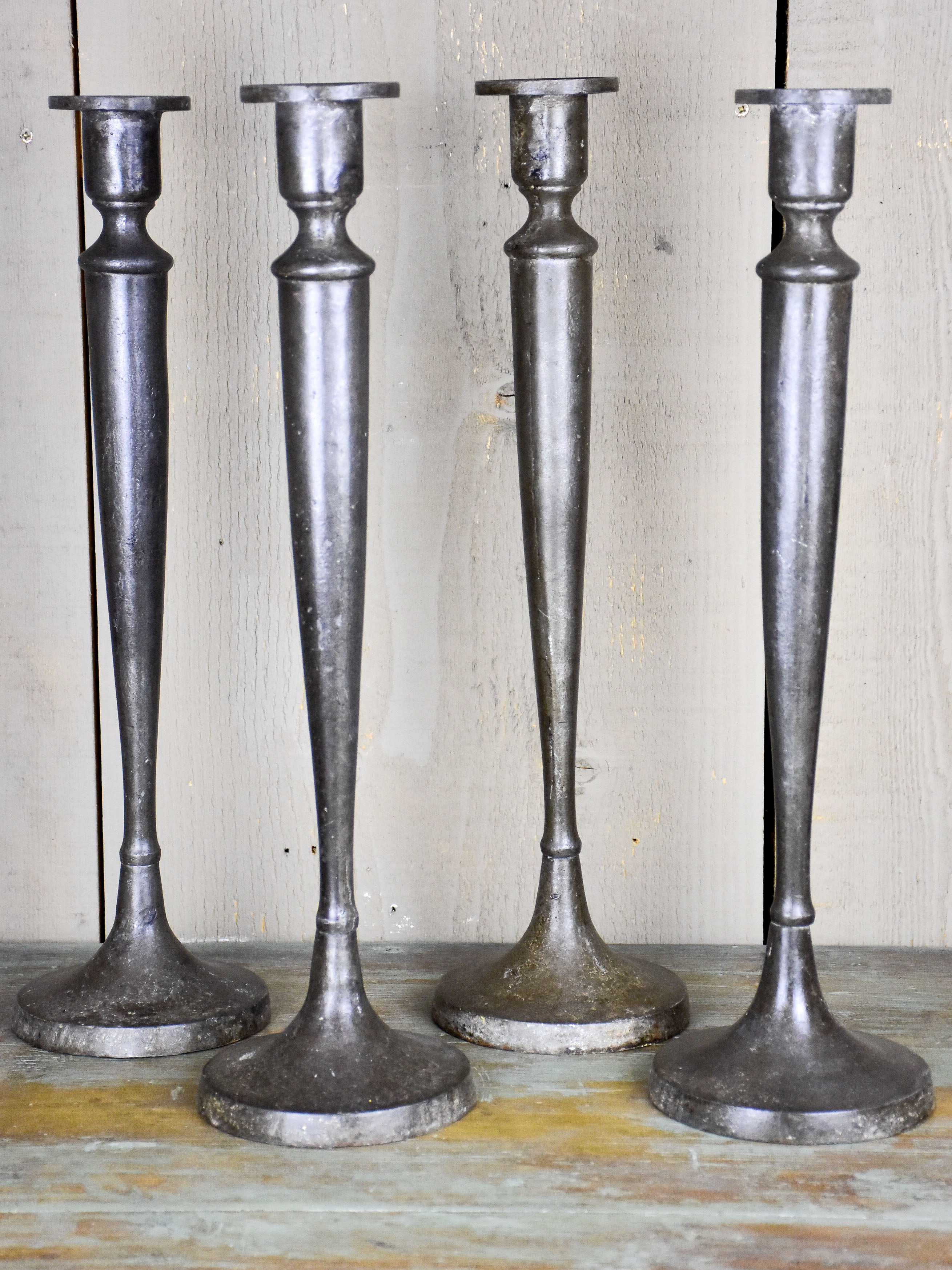 Set of four antique French candlesticks