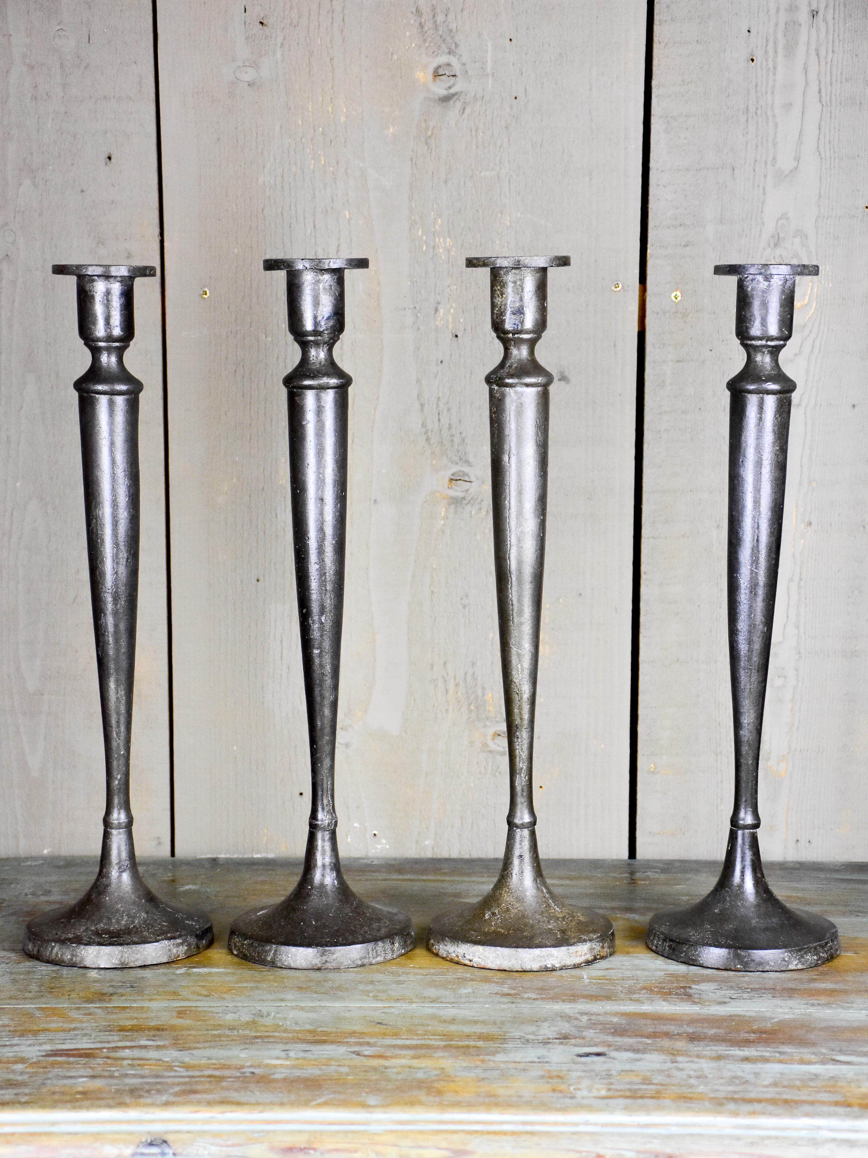 Set of four antique French candlesticks