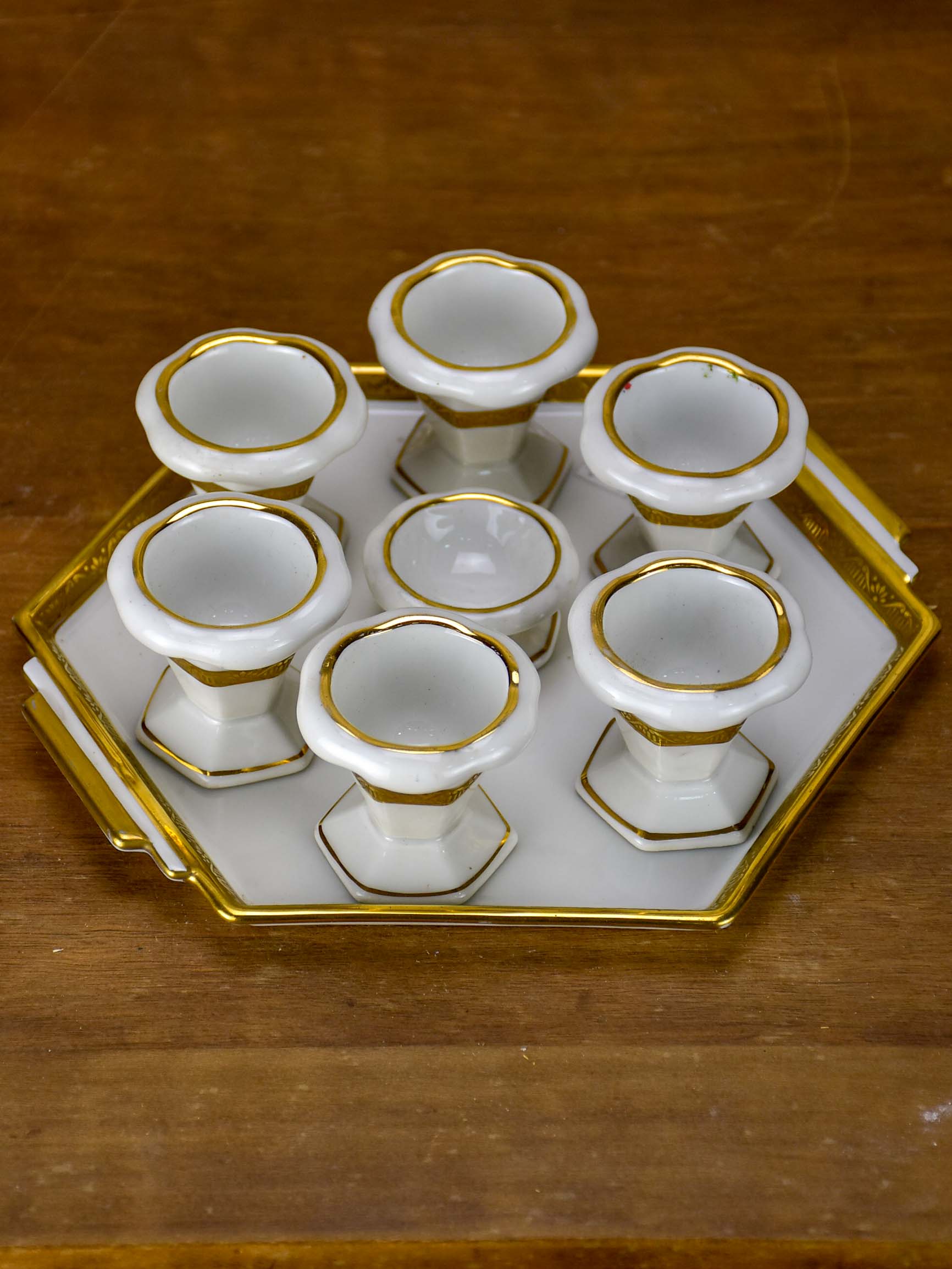 Antique French Limoges egg cups on a platter