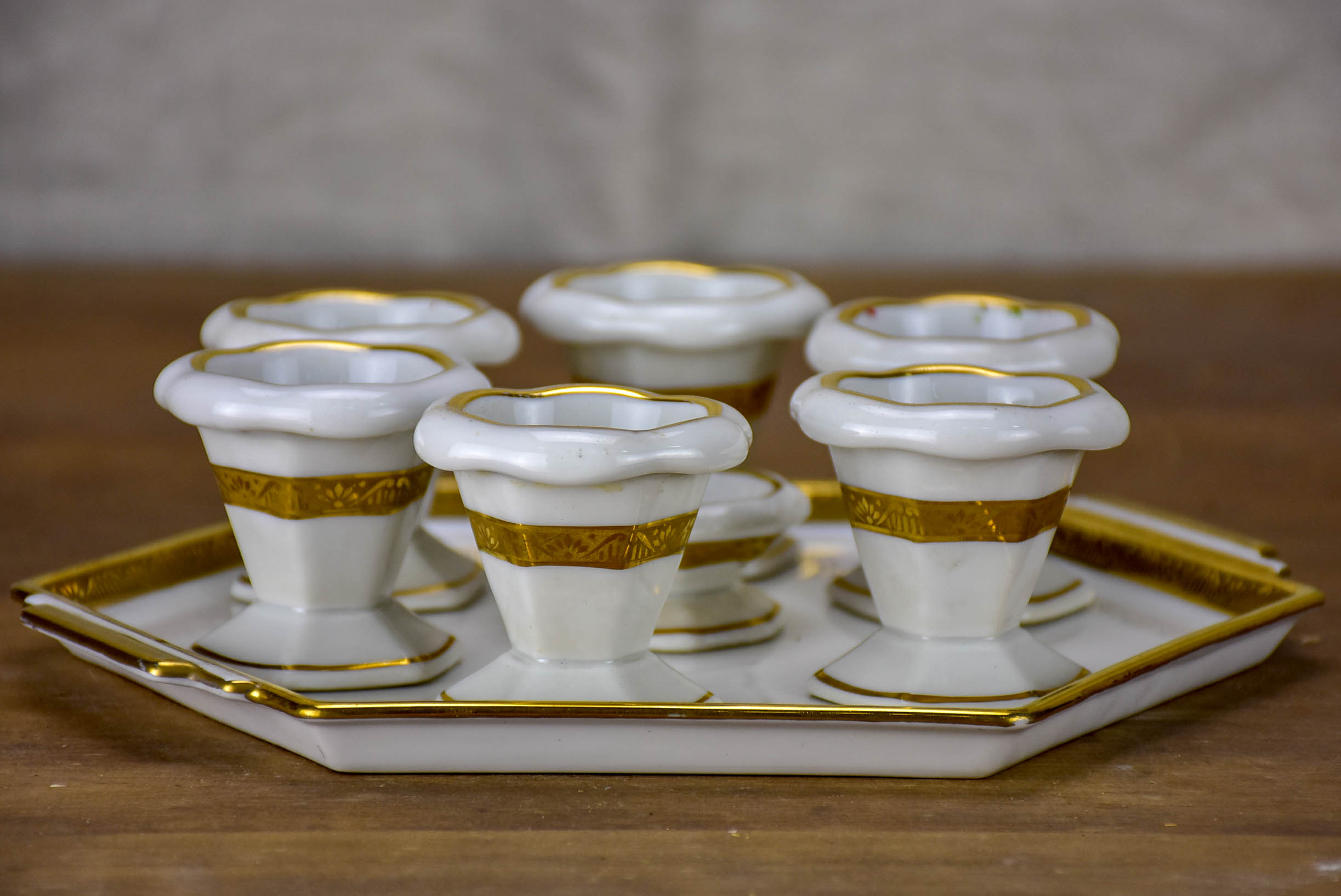 Antique French Limoges egg cups on a platter