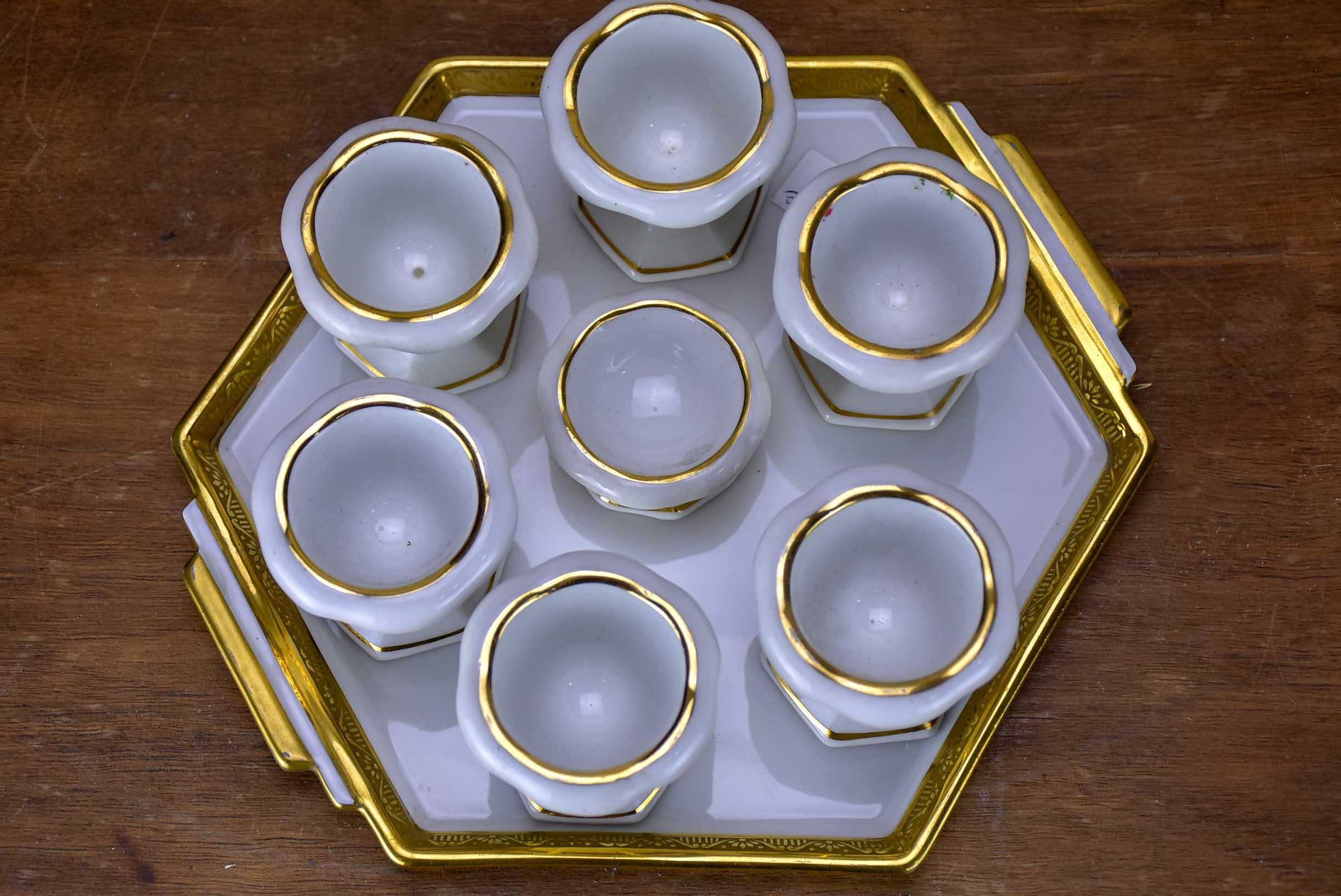 Antique French Limoges egg cups on a platter